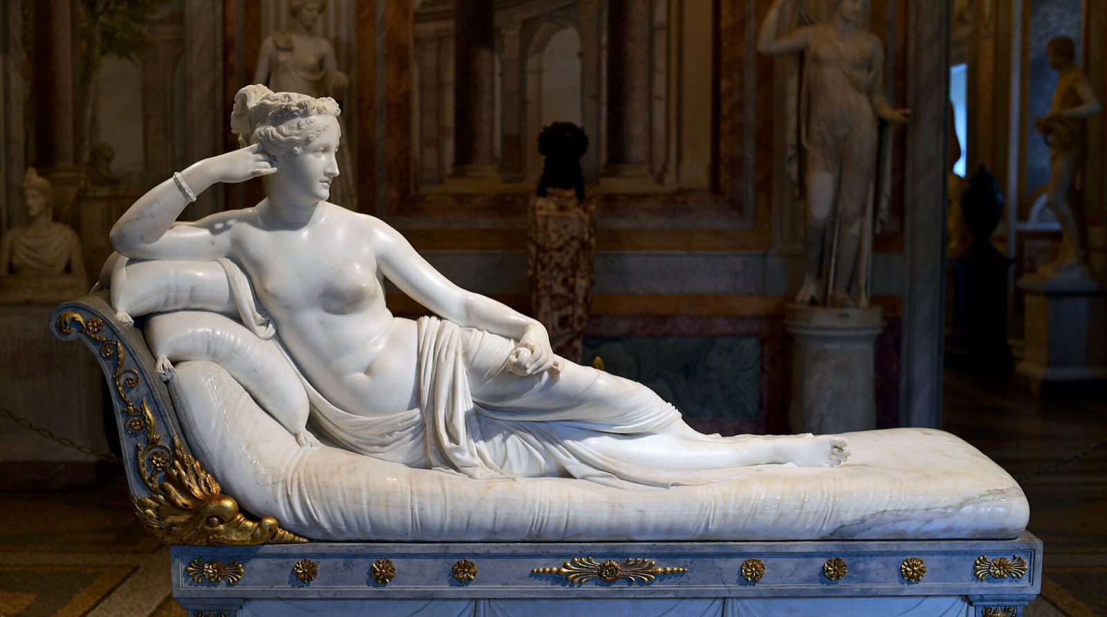 Canova's marble of Pauline Bonaparte as Venus, reclining on a couch with an apple in her hand.