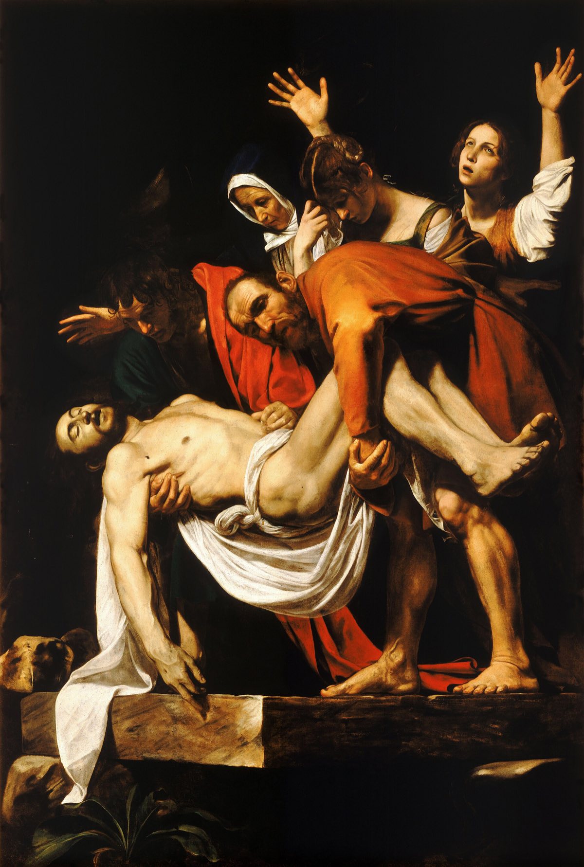 The Entombment of Christ by Caravaggio: the body lowered onto a stone slab by two men, with three women grieving behind.