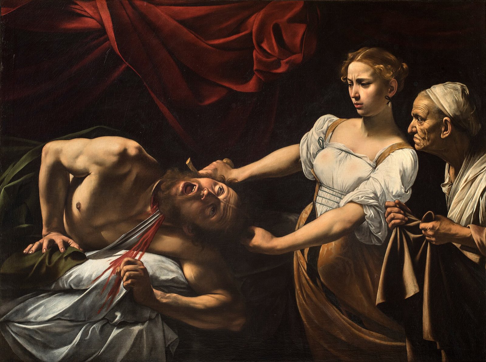 Judith Beheading Holofernes by Caravaggio: a young woman draws a sword through the neck of a man on a bed, an old servant at her side.