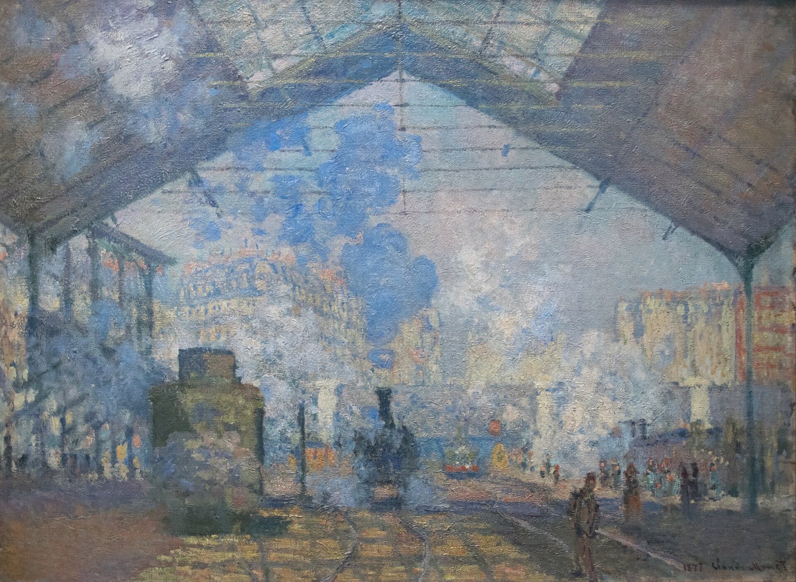 The Saint-Lazare Station, by Monet: a locomotive in clouds of steam under the glass roof of the station.