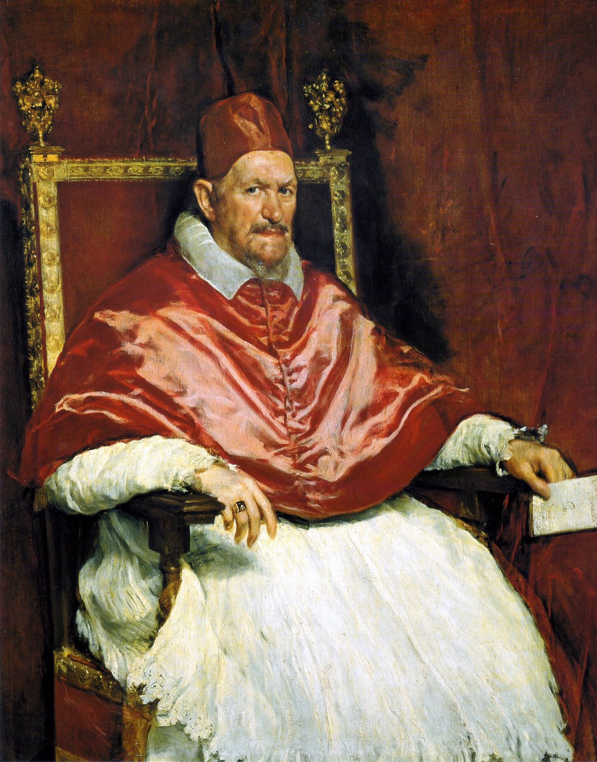 The Portrait of Innocent X by Velázquez: the pope seated in red cap and cape, looking sharply out.