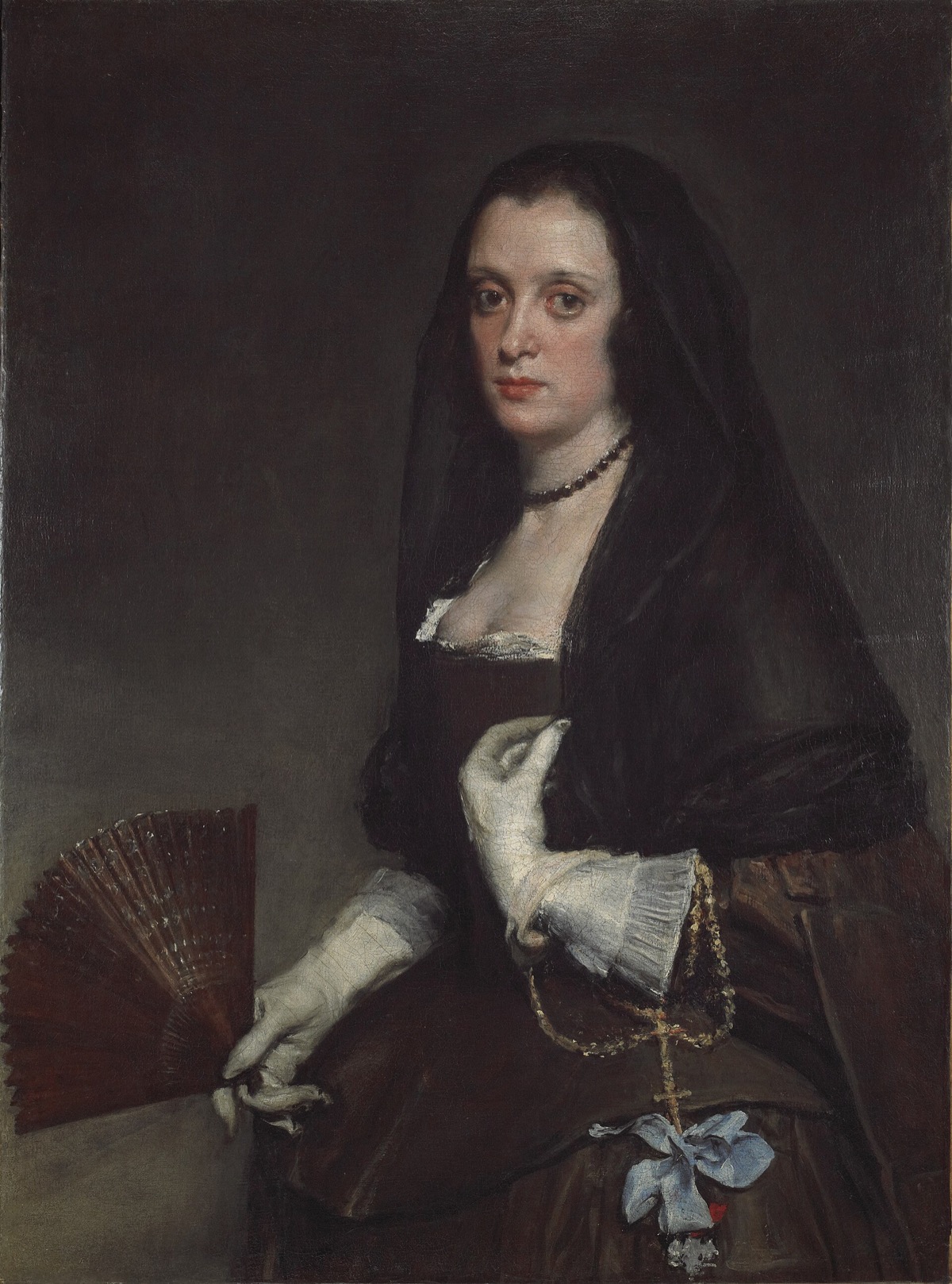 The Lady with a Fan, by Velázquez: a woman in a brown dress and black veil, gloved, holding a half-open fan.