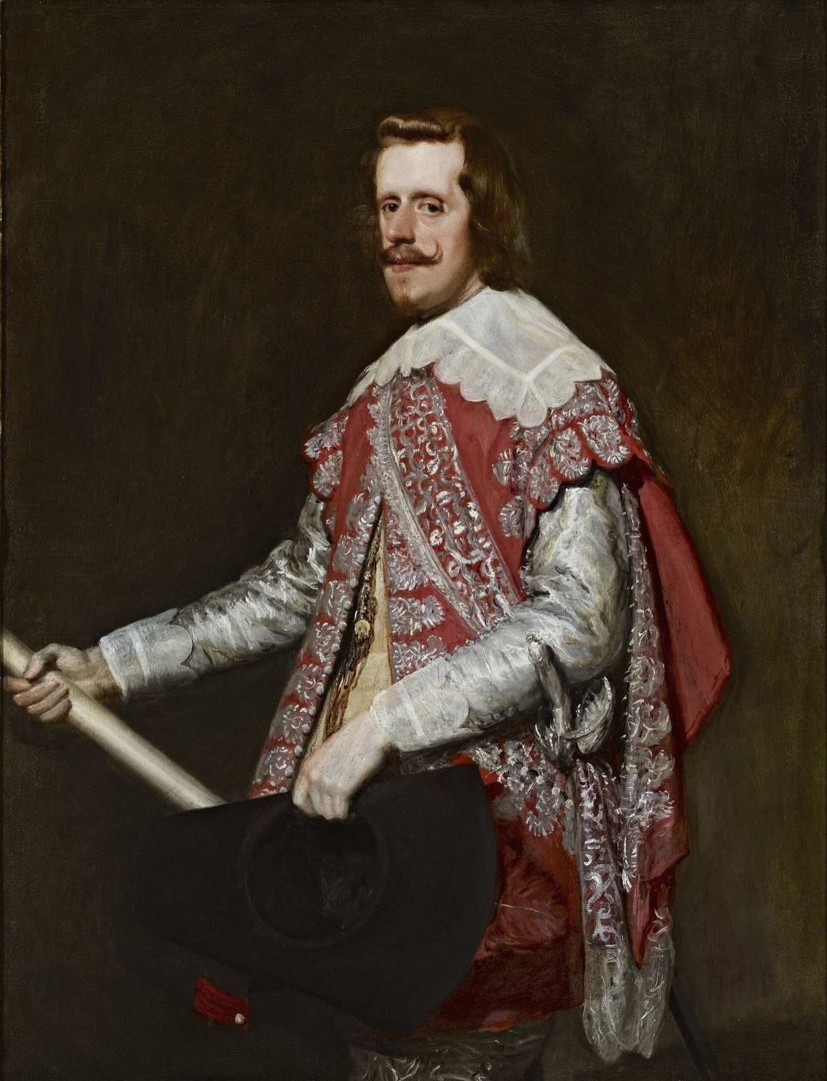 King Philip IV of Spain, by Velázquez: the king in a red and silver campaign dress, holding a baton and a hat.