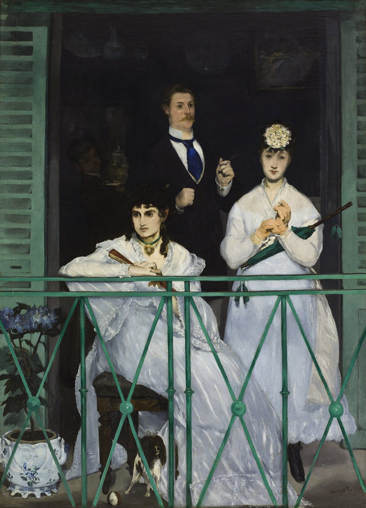 The Balcony, by Manet: two women and a man behind a green iron railing.