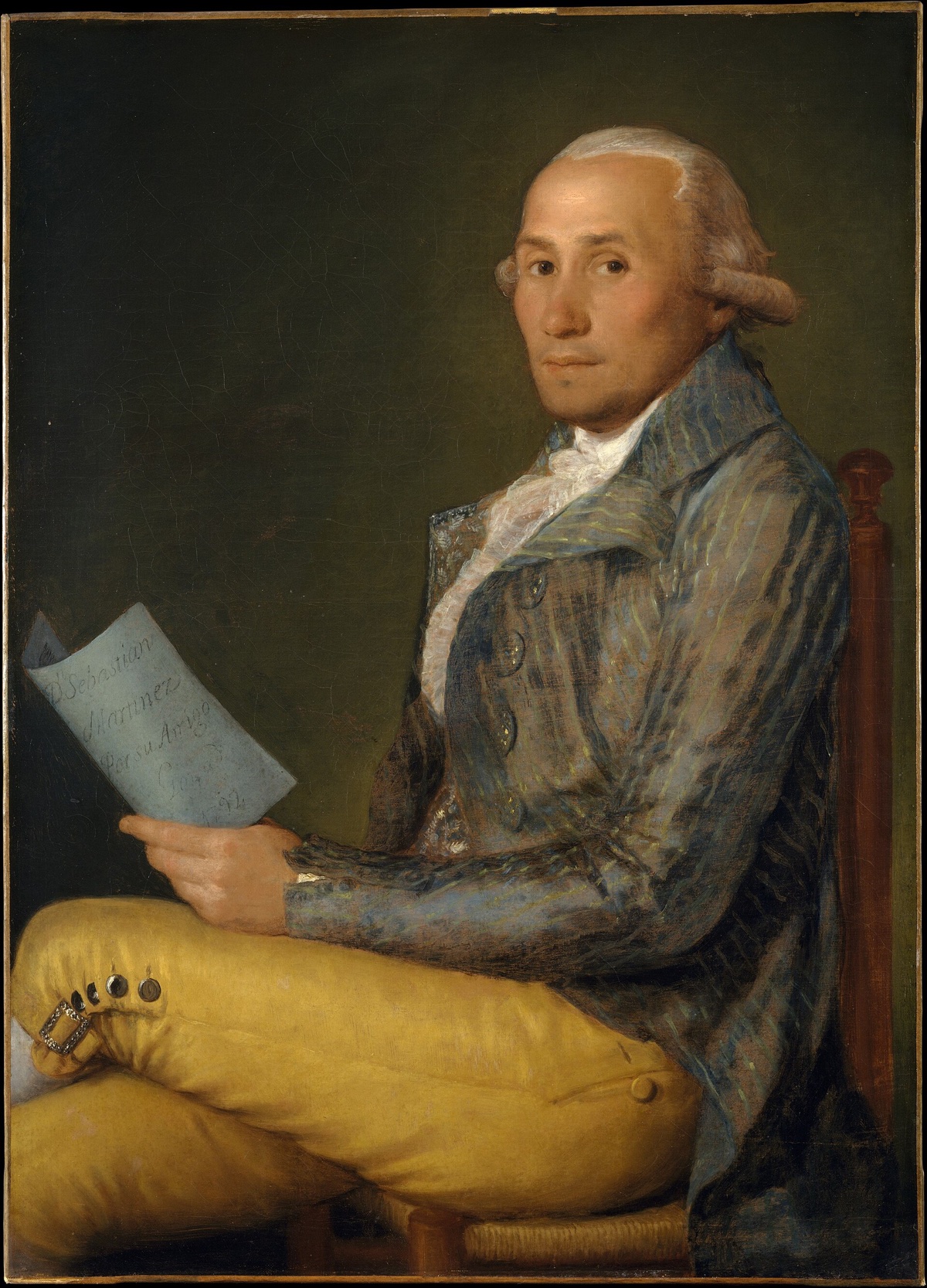 Don Sebastián Martínez y Pérez, by Goya: a seated man in a coat of blue and yellow stripes, holding a letter.