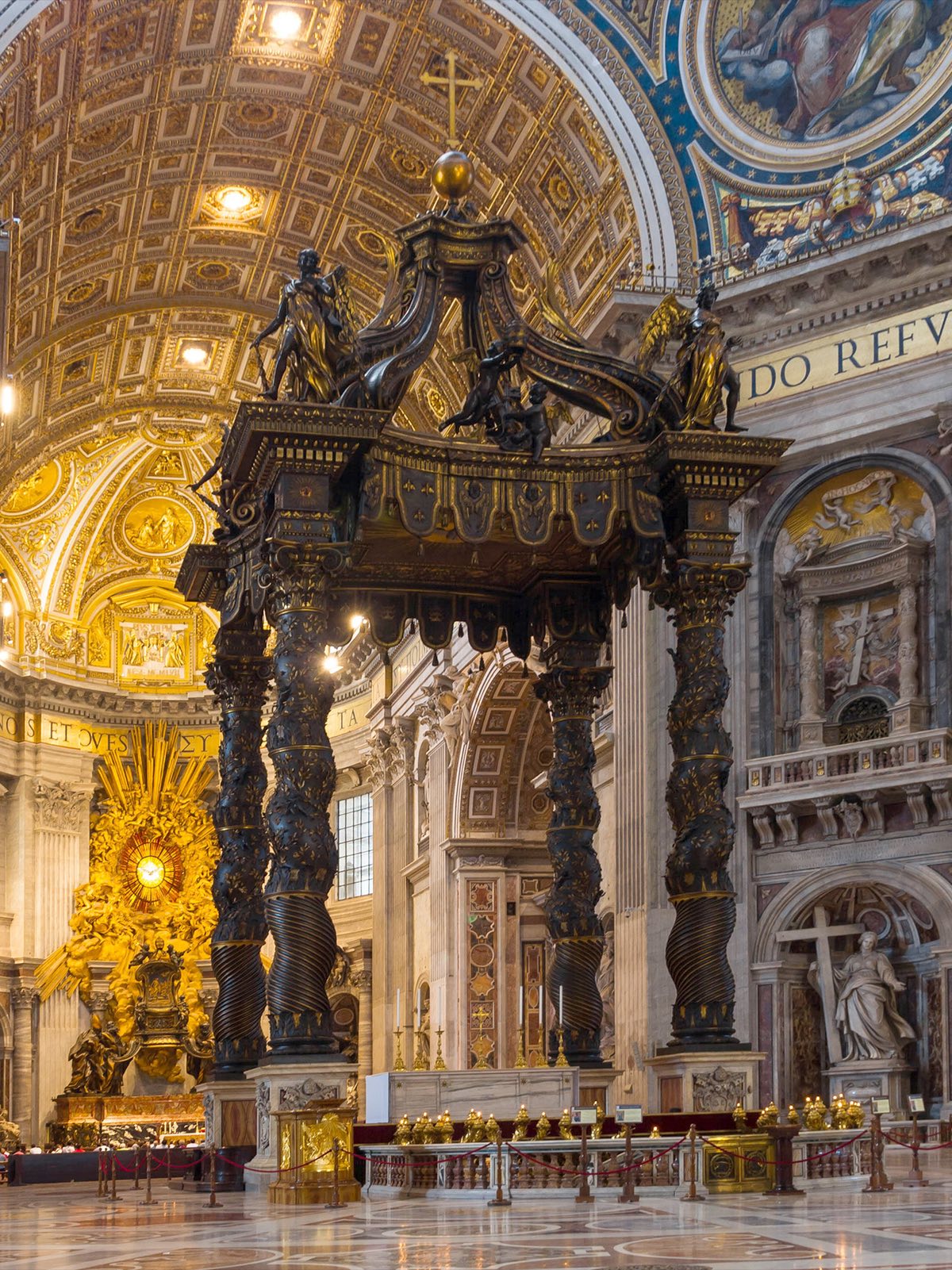 Bernini's bronze baldachin on its four twisted columns, under the dome of St Peter's.
