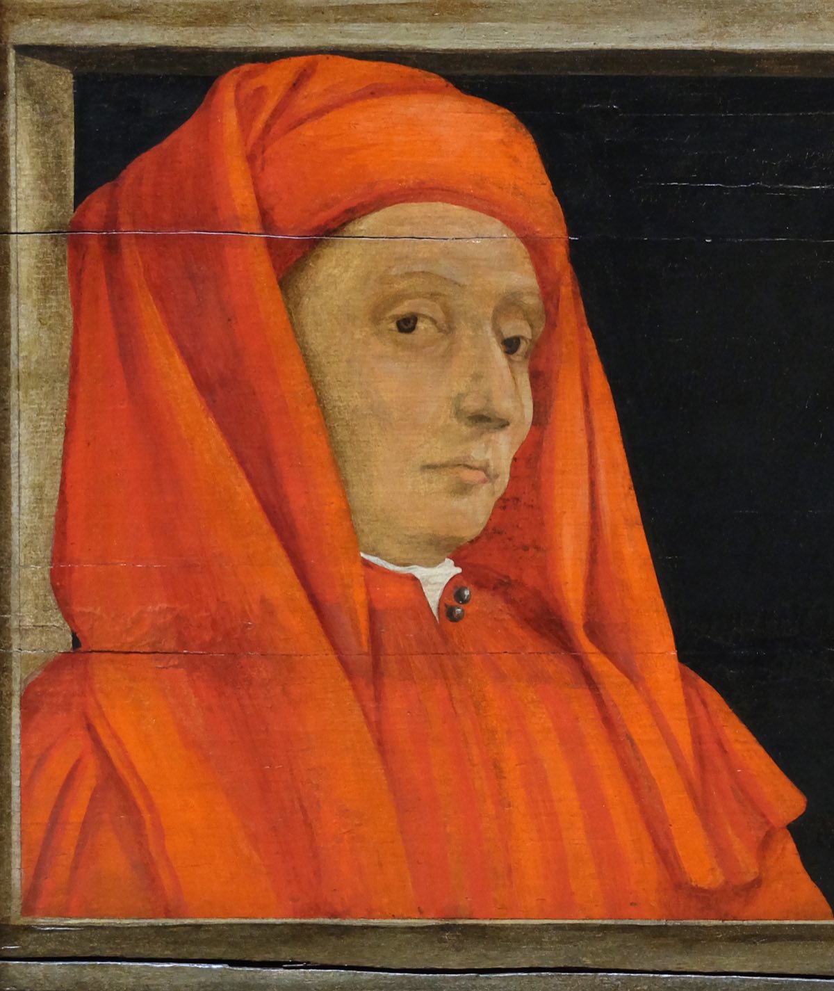 A fifteenth-century portrait of Giotto in profile, wearing a red cap.