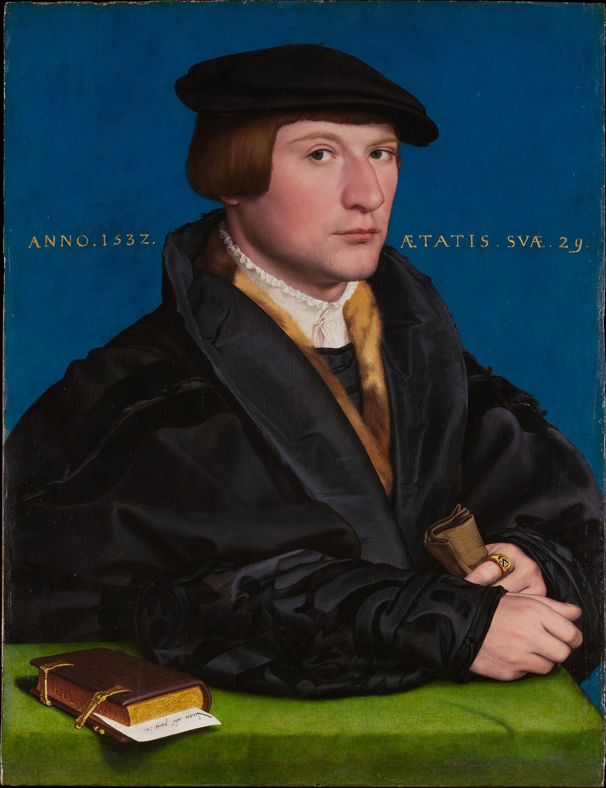 Hermann von Wedigh III, by Hans Holbein the Younger: a young merchant in black against a blue ground, with a book and gloves.