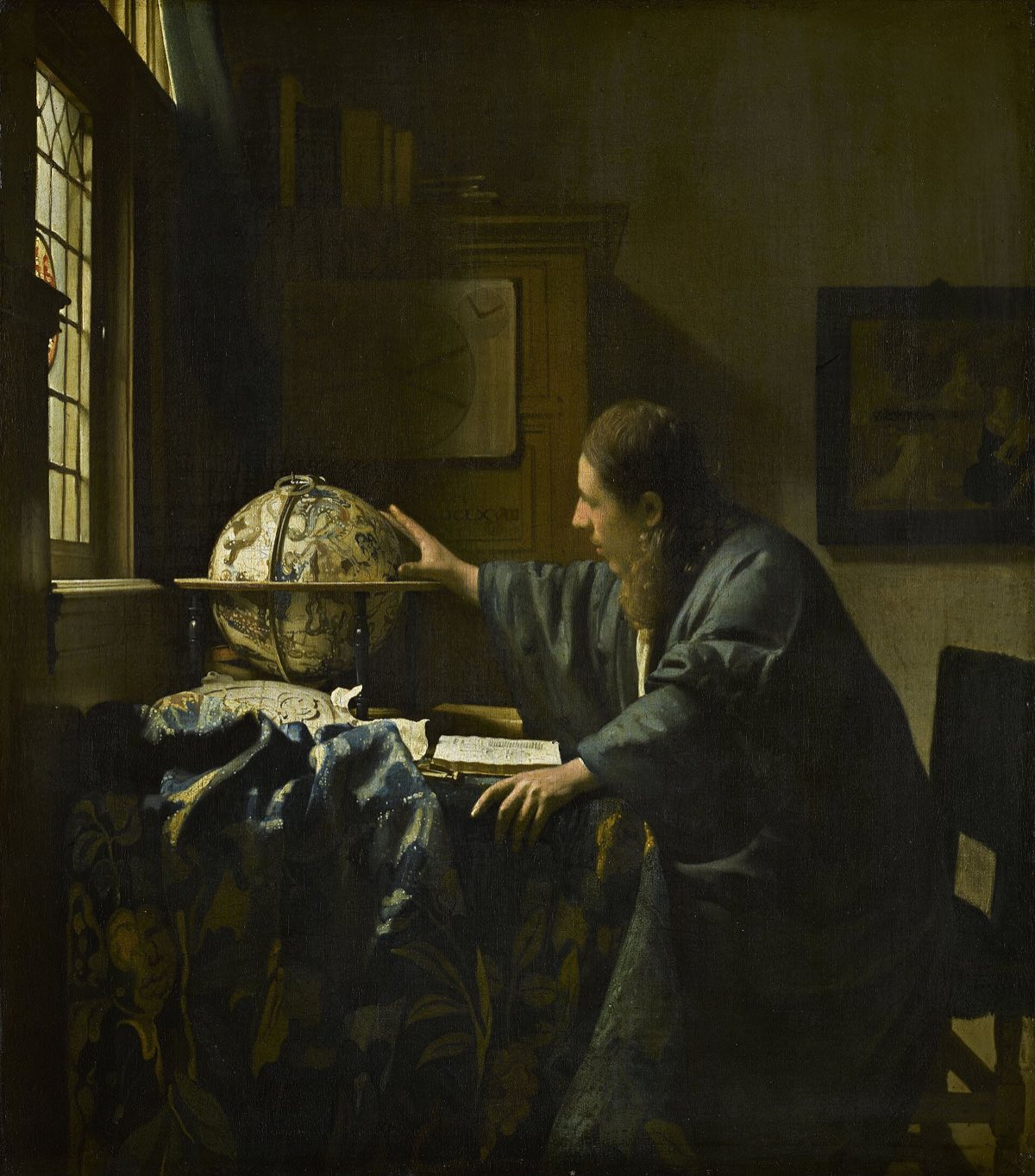 The Astronomer, by Vermeer: a scholar at a window, reaching for a celestial globe.