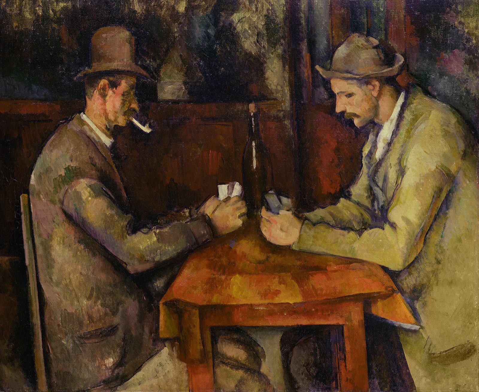 The Card Players, by Cézanne: two men in hats facing each other across a small table.