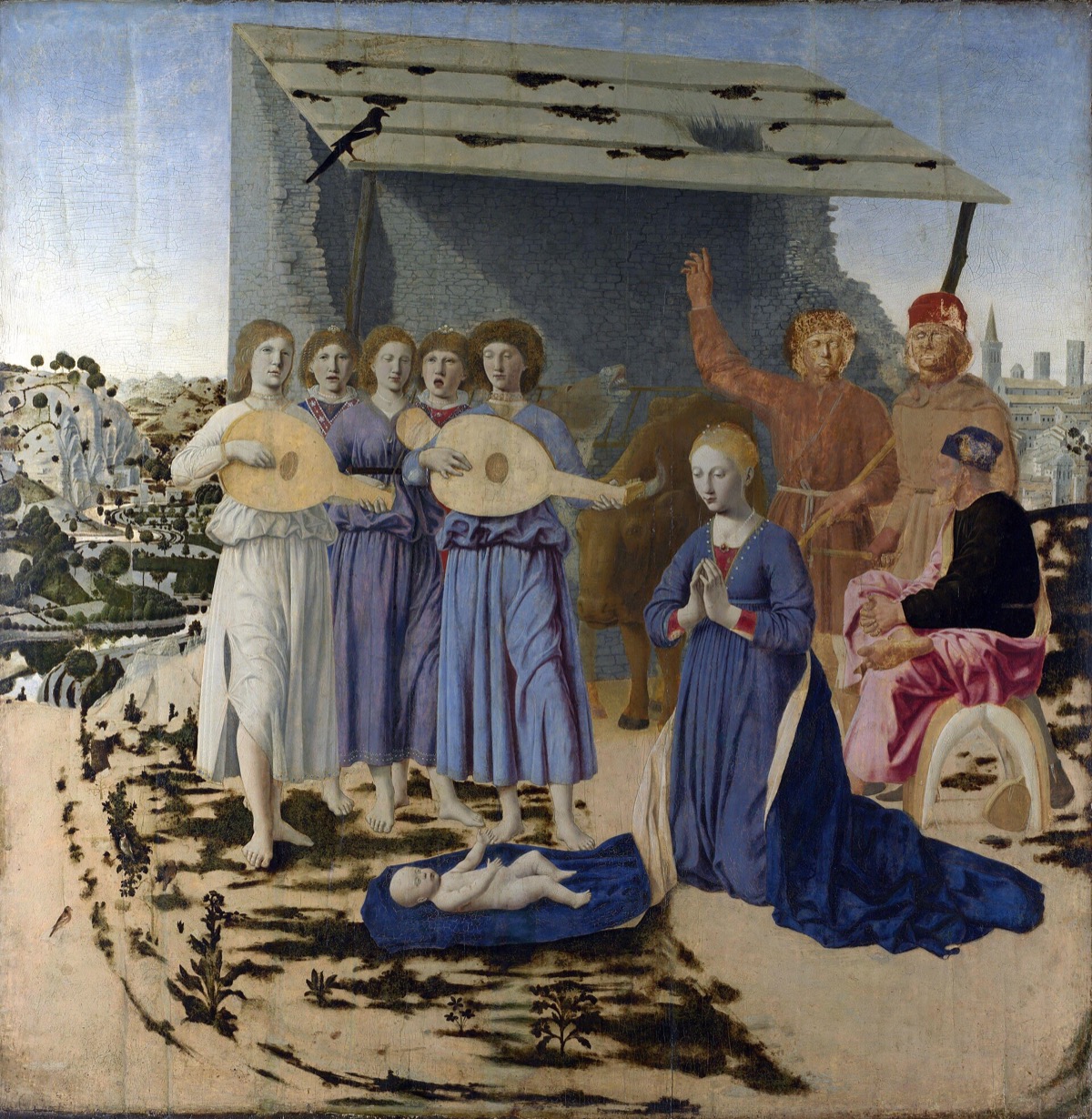 The Nativity, by Piero della Francesca: the Virgin kneels before the child while five angels sing to lutes.