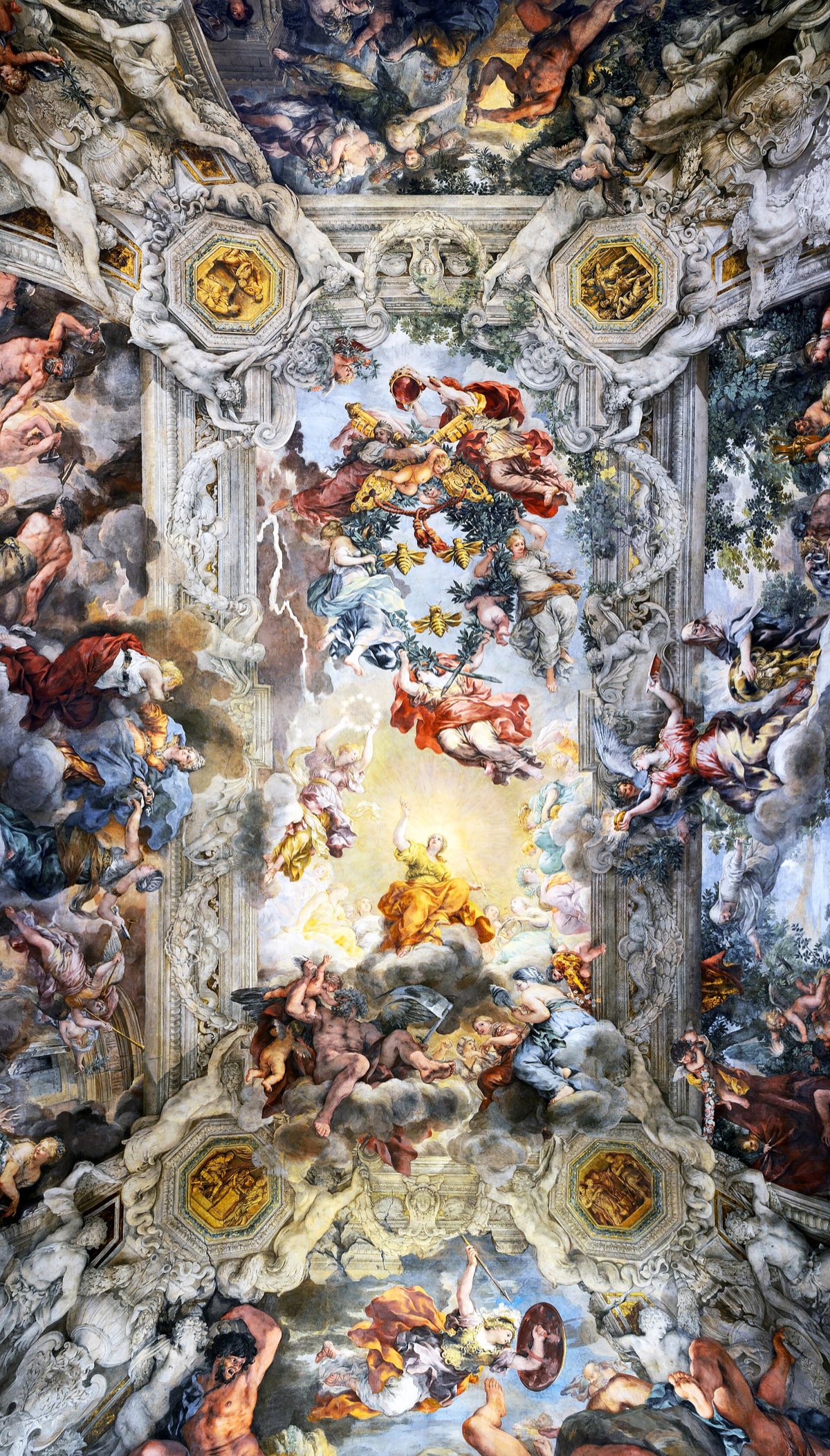 The ceiling of the great hall of Palazzo Barberini by Pietro da Cortona: figures swirling through an open painted sky.