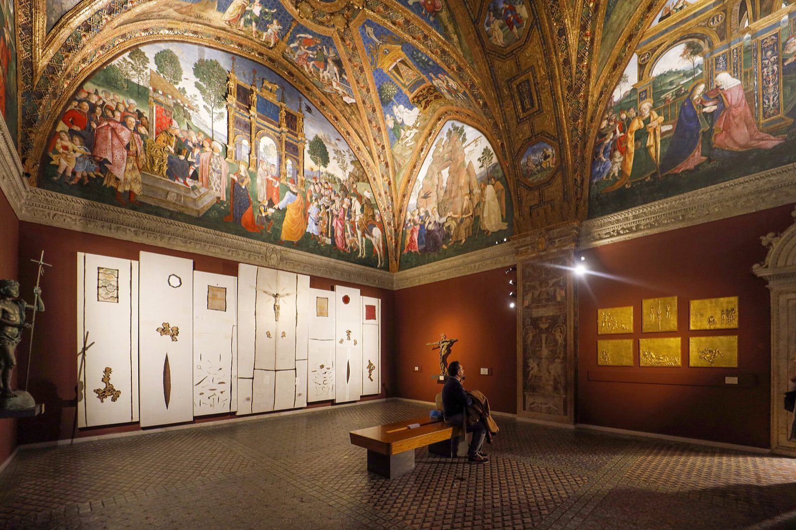 A room of the Borgia Apartments in the Vatican, its vault and walls covered with Pinturicchio's gilded frescoes.