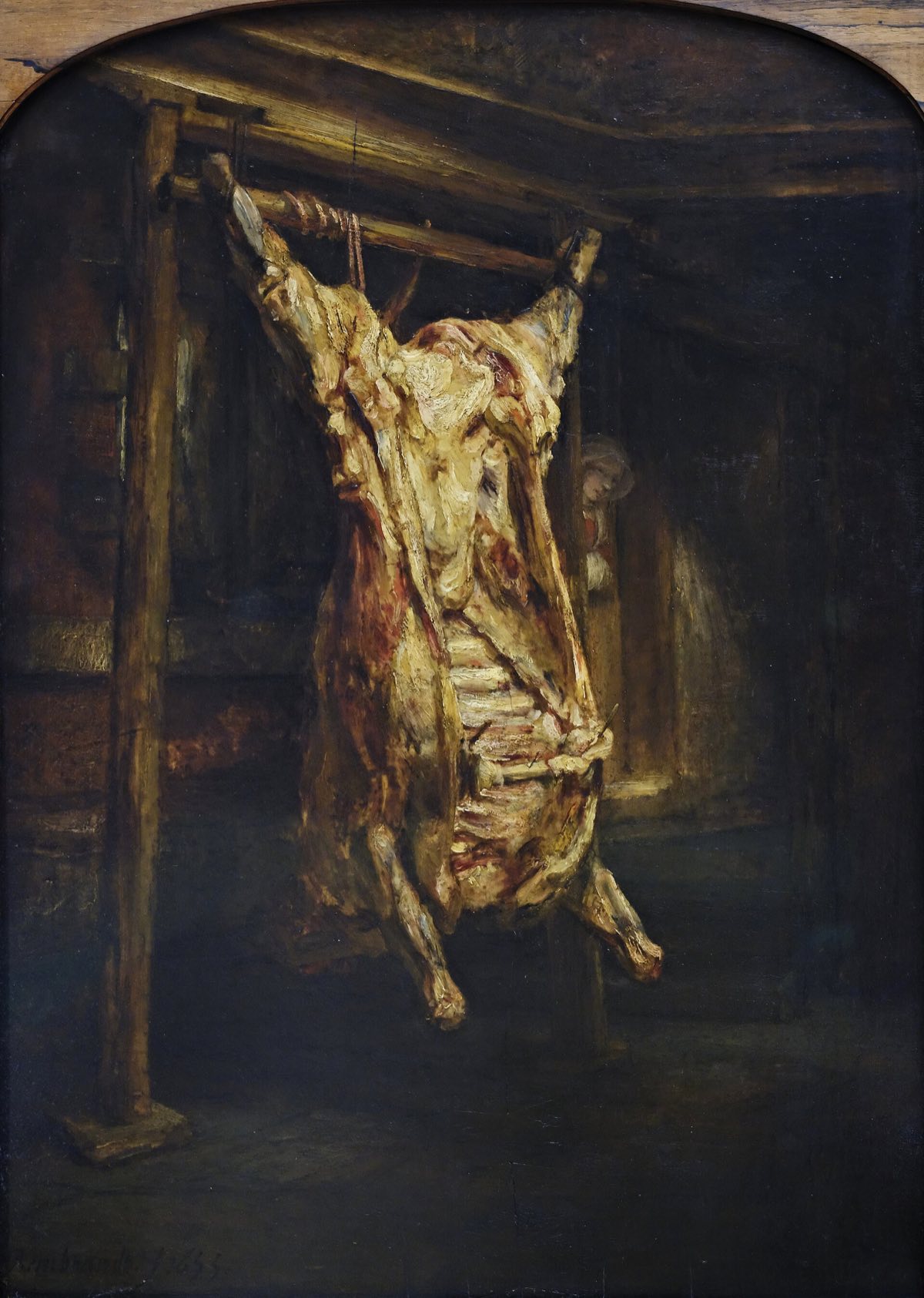 The Slaughtered Ox, by Rembrandt: a carcass hanging in a dark cellar.