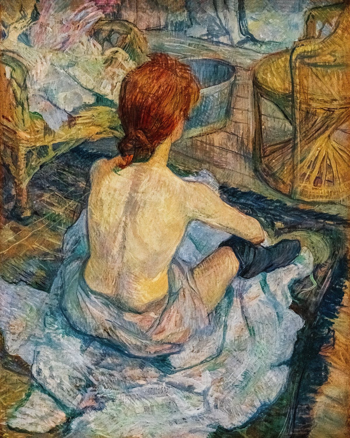 La Toilette, by Toulouse-Lautrec: a red-haired woman seen from behind, sitting on the floor.