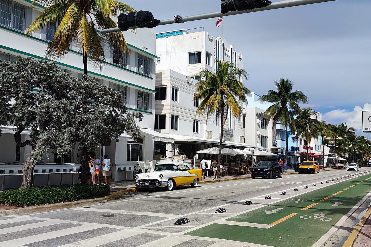 Art Deco hotels and palm trees along Ocean Drive in Miami Beach.