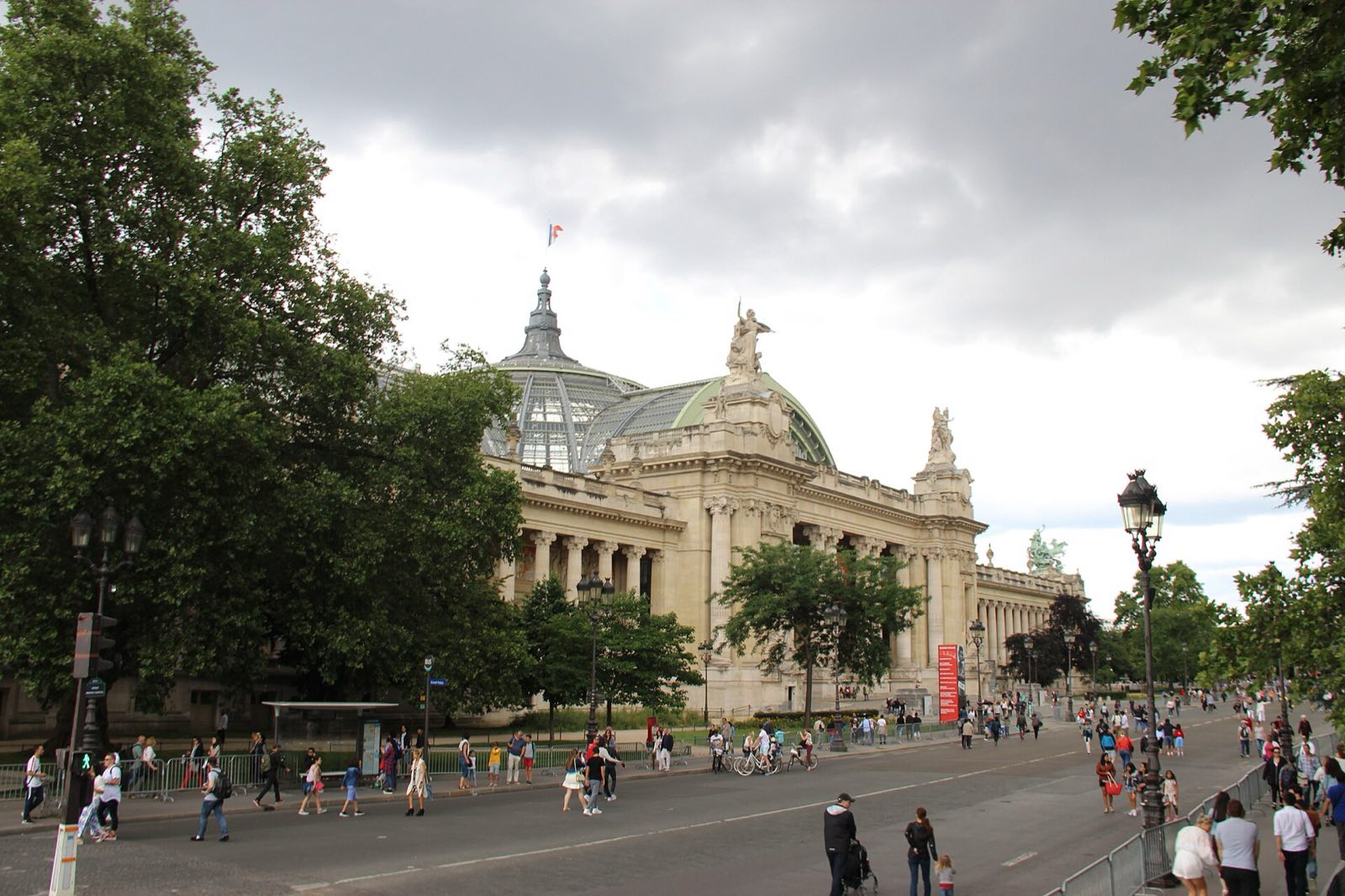The Grand Palais in Paris, with its glass dome above the trees.