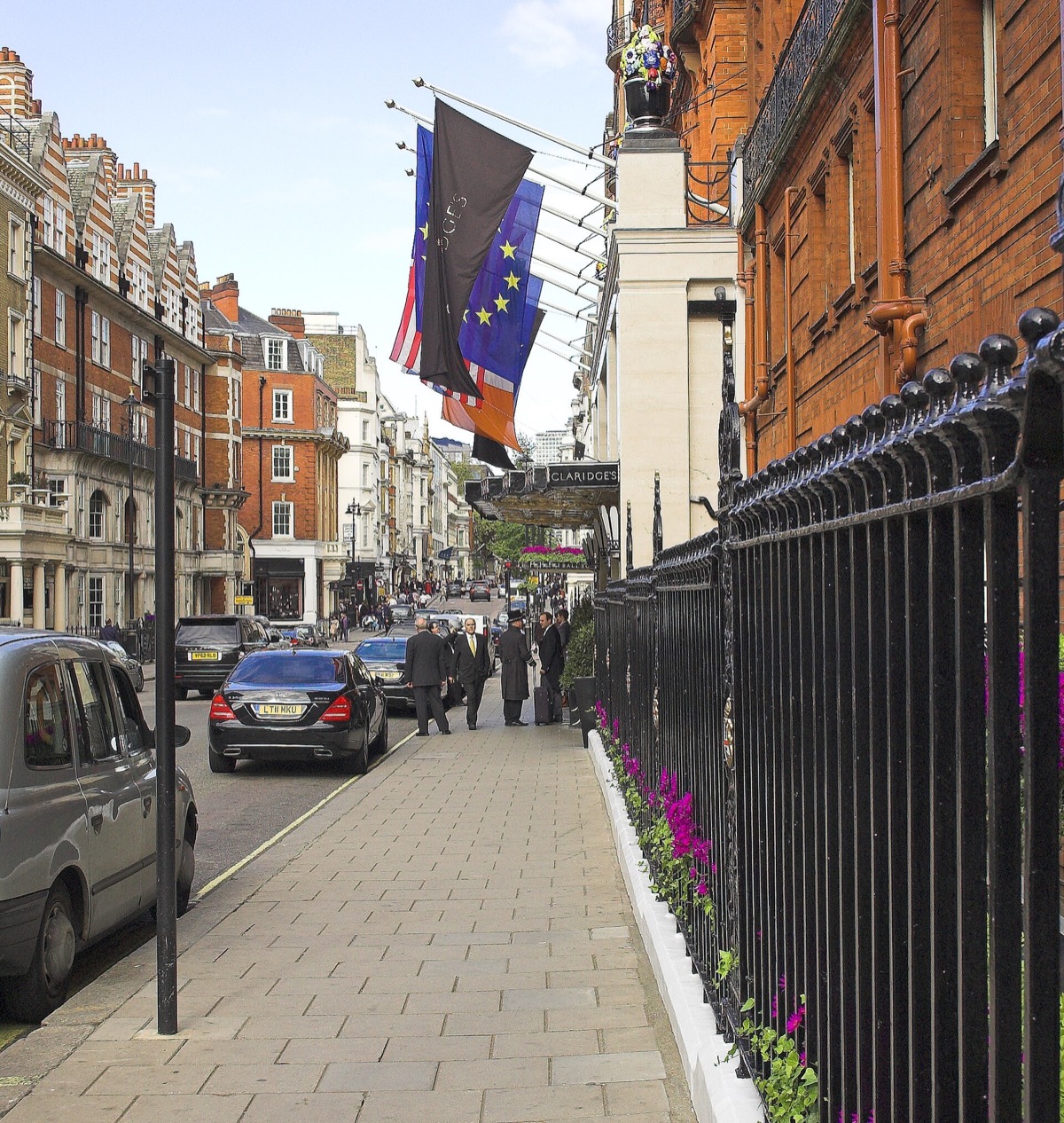 Brook Street in Mayfair, with the flags of Claridge's on the left.