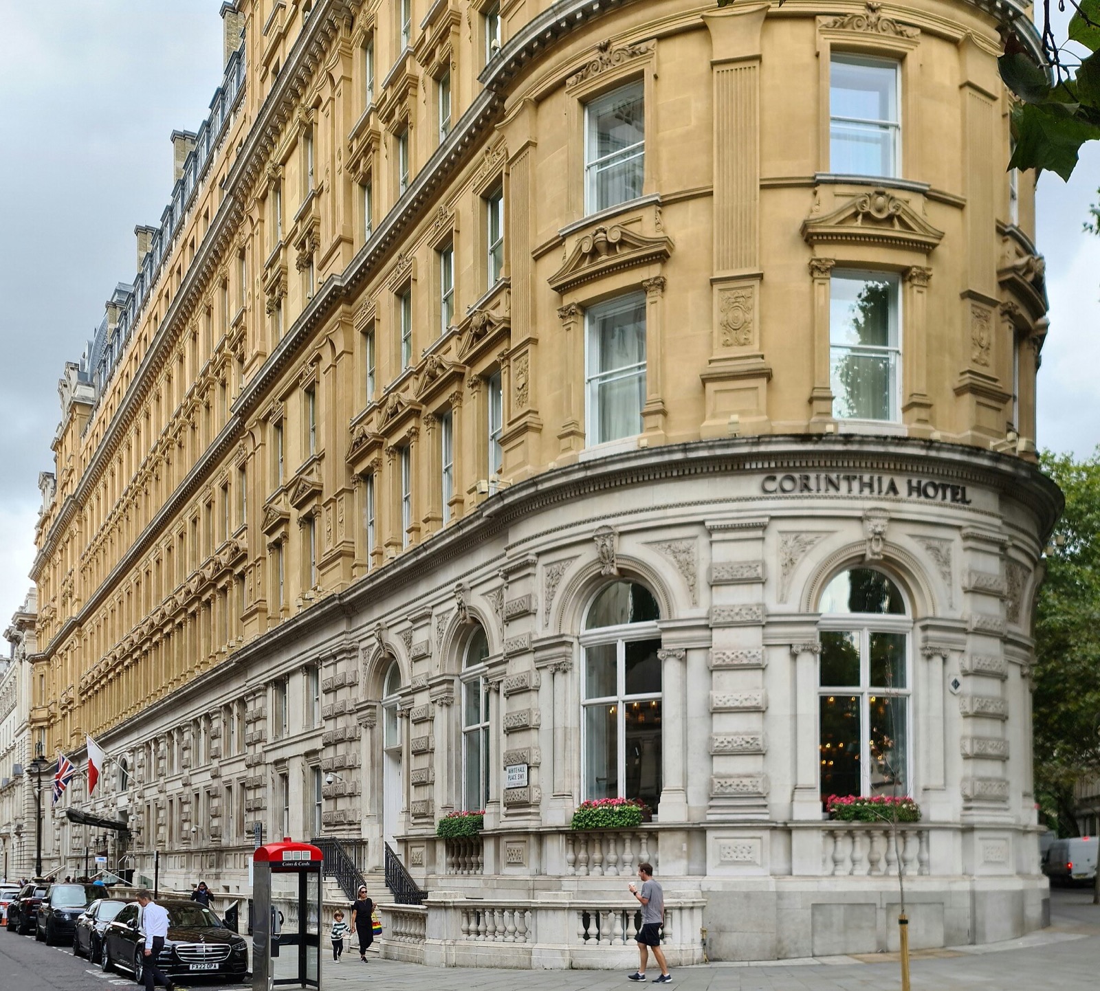 The Corinthia London, a long Victorian hotel of pale stone curving round the corner of Whitehall Place.