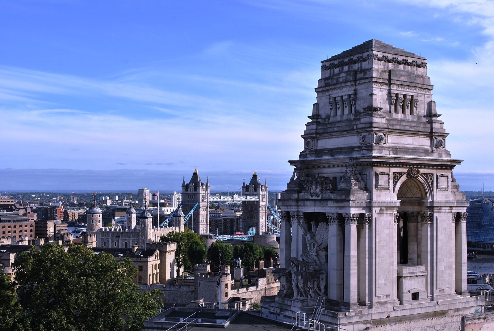 The tower of Ten Trinity Square, with Tower Bridge and the Thames beyond it.
