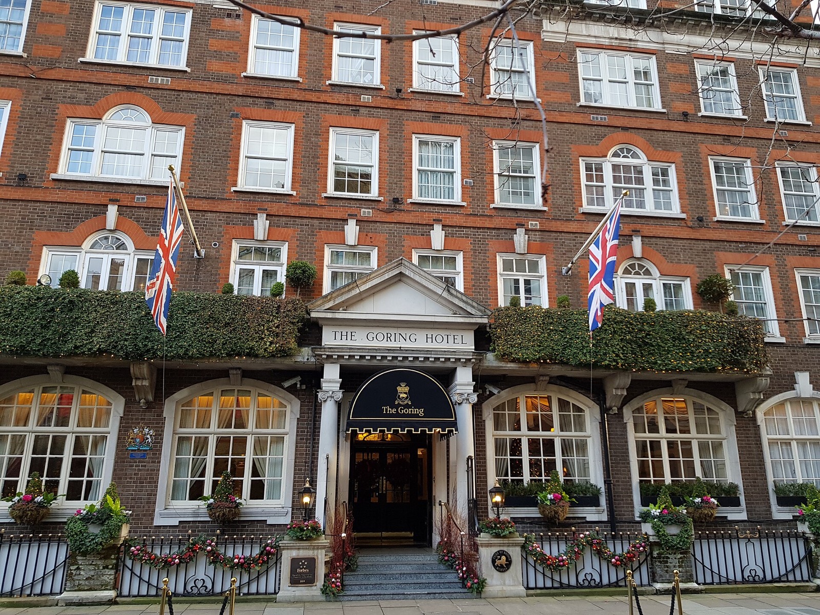 The Goring on Beeston Place, a red-brick Edwardian hotel with flags and window boxes.