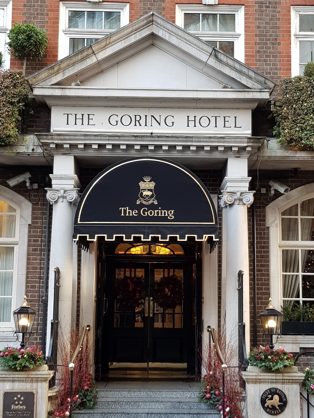 The columned porch of the Goring, with the hotel's name above it.