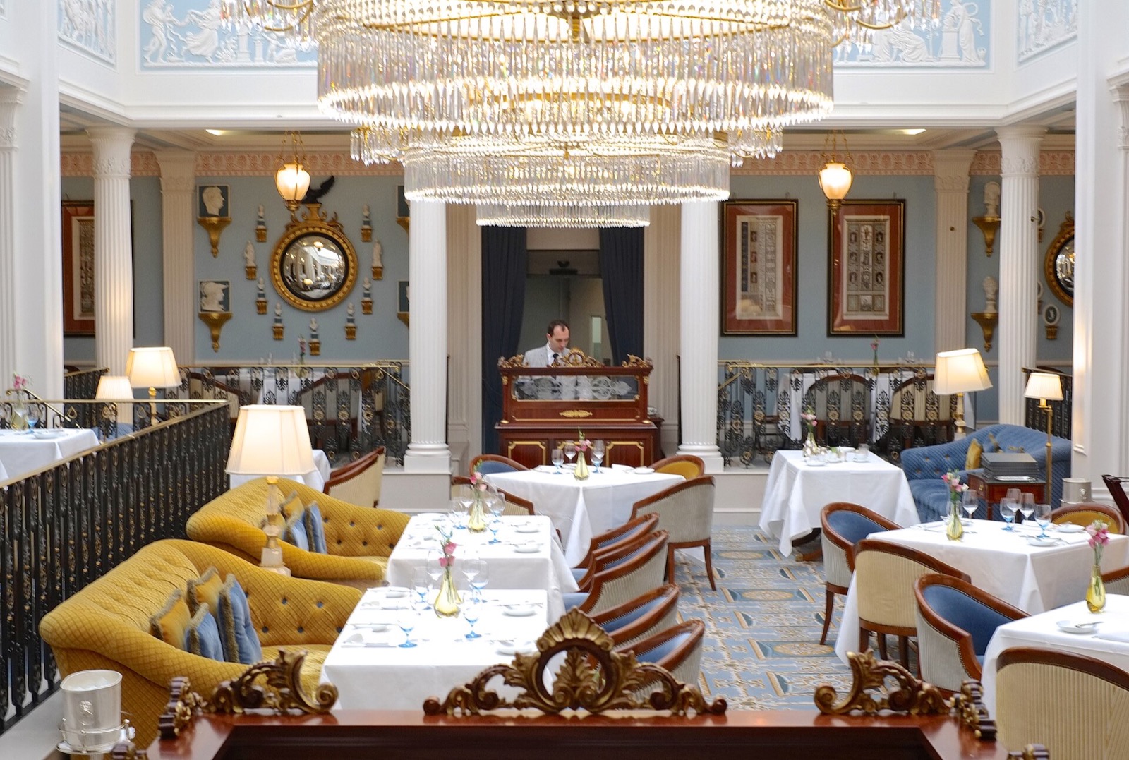 The restaurant of the Lanesborough, a Regency room with chandeliers under a glass roof.