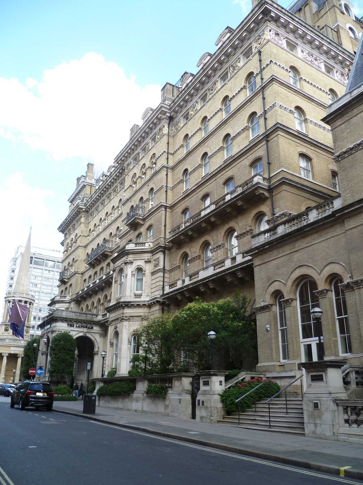 The Langham seen from the pavement, seven floors of stone balconies and bay windows.