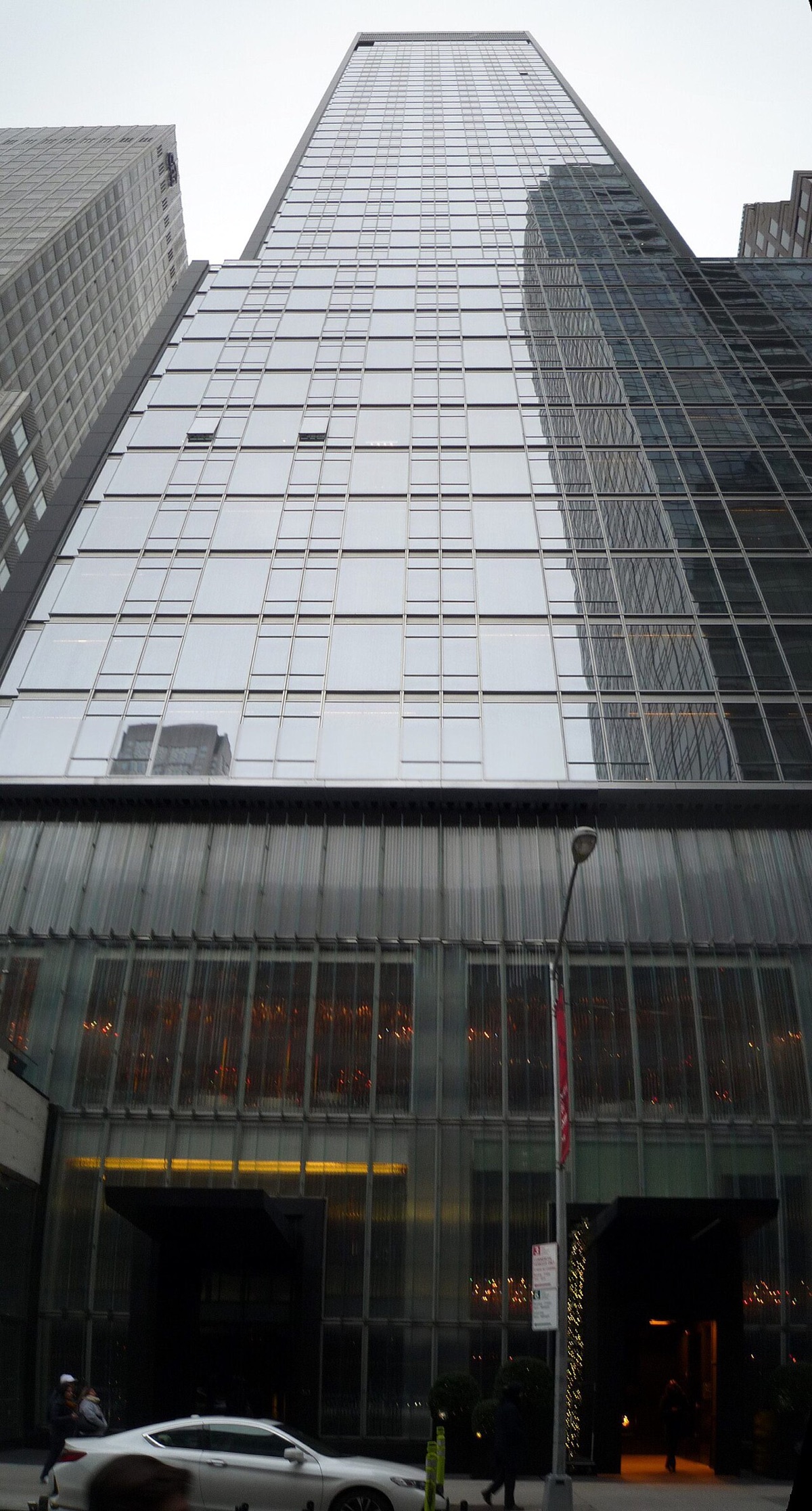 The glass tower that holds the Baccarat Hotel on its lower floors.