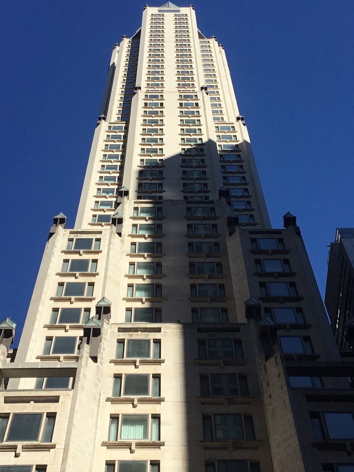 The Four Seasons Hotel New York from the street, rising in setbacks.