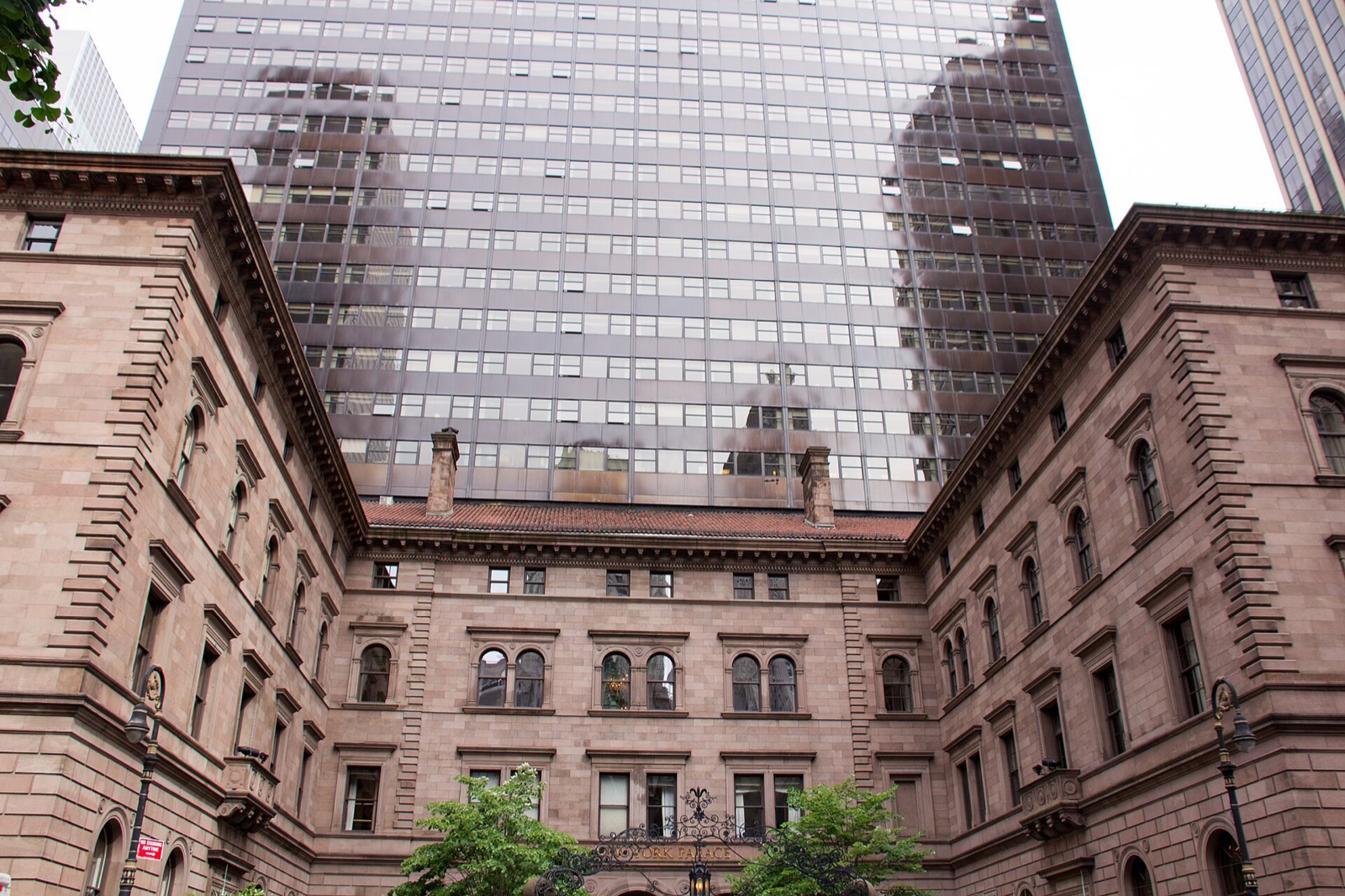 The courtyard of the Villard Houses on Madison Avenue, with the hotel's tower rising behind them.