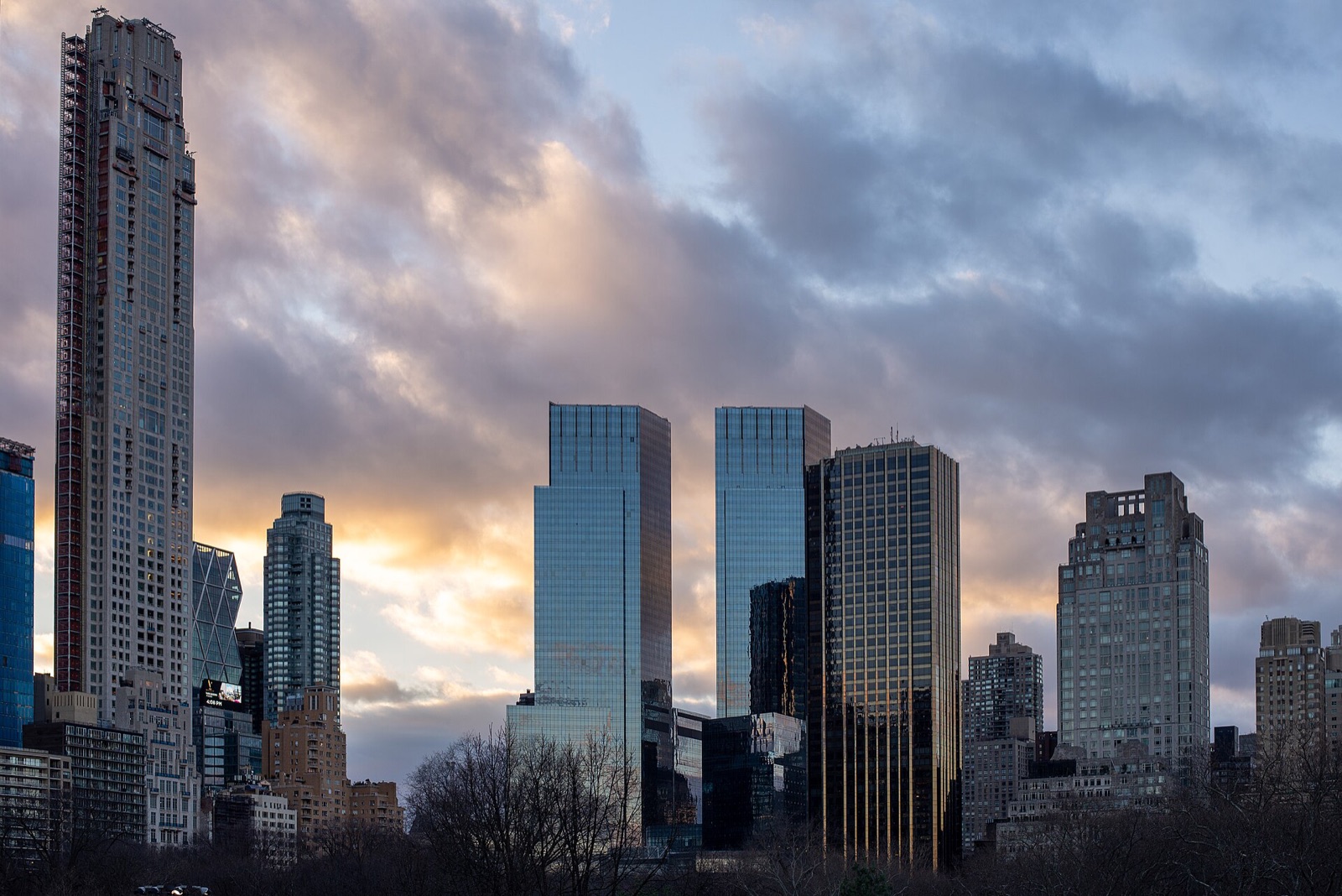 The glass towers at Columbus Circle, where the hotel has its floors, seen at dusk from Central Park.