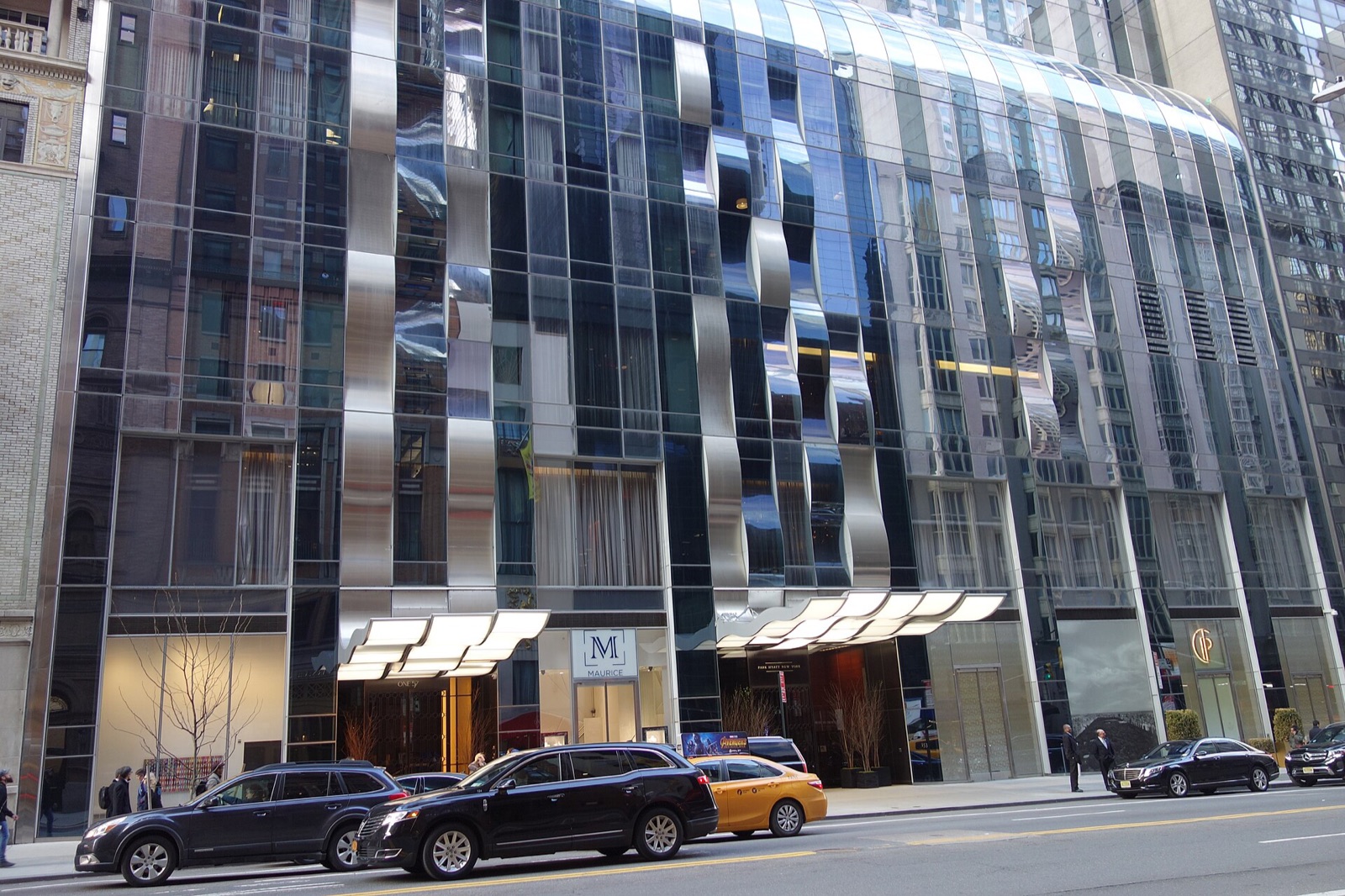 The base of One57 on West 57th Street, with the entrance of the Park Hyatt.