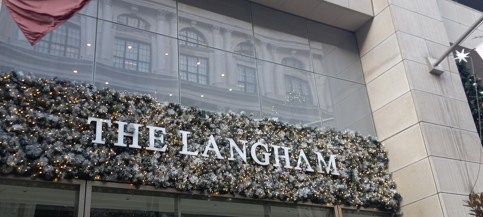 The name of the Langham in metal letters over its entrance.