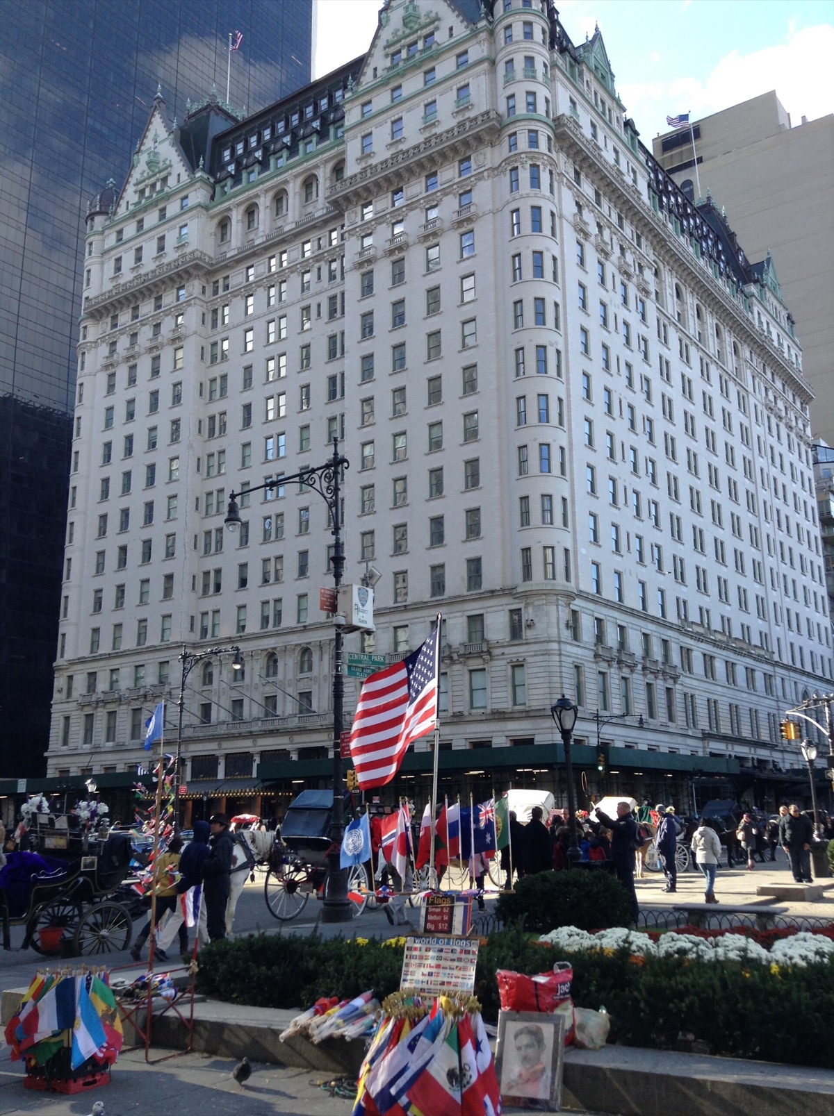 The front of the Plaza on Grand Army Plaza, with flags over the entrance.