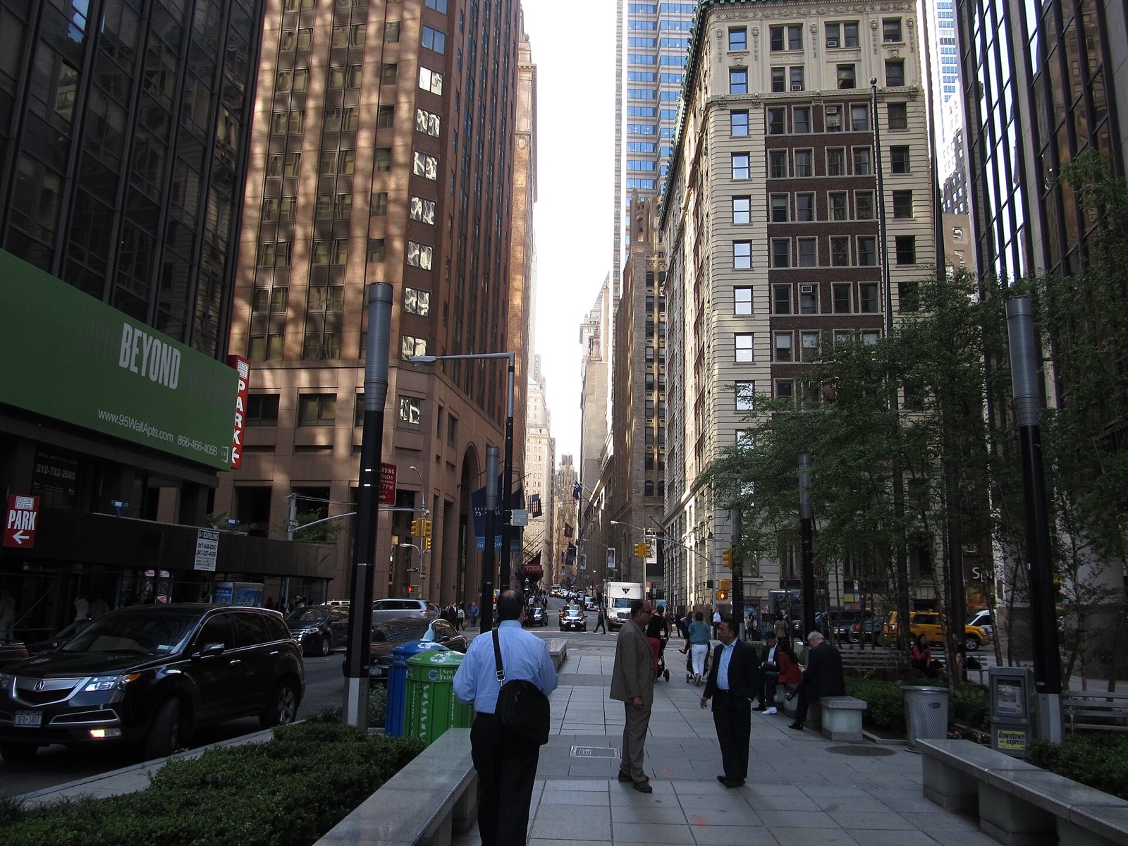 Wall Street in the Financial District, a narrow street between tall office buildings.