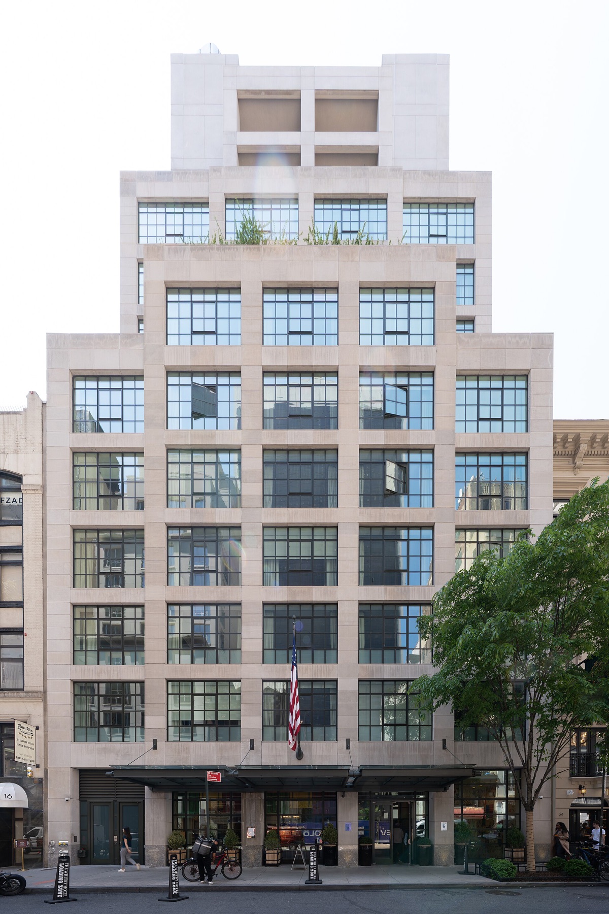 The Whitby Hotel on West 56th Street, a stepped front of pale stone with large steel windows.
