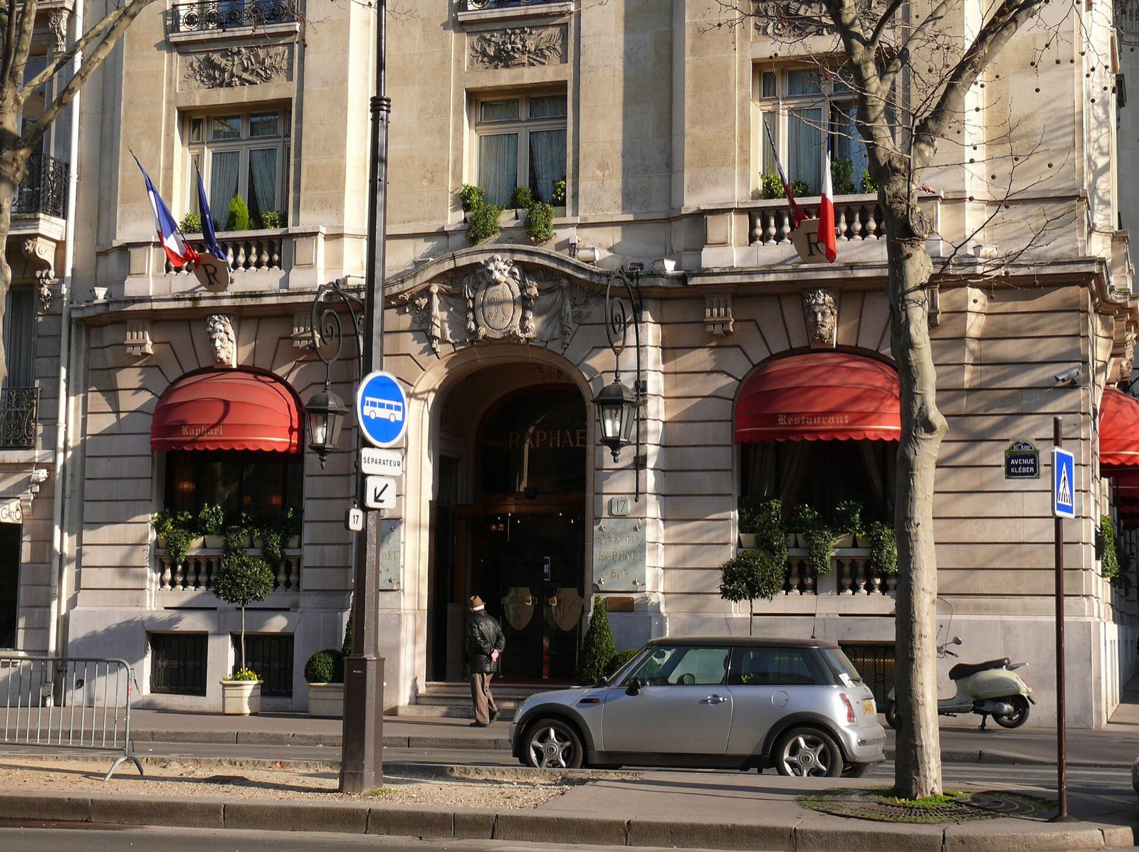 The Hôtel Raphael on the avenue Kléber, with red awnings over its ground-floor windows.