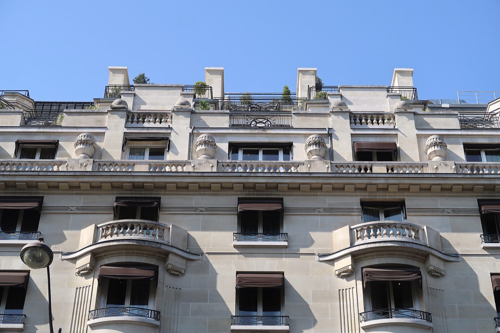 Balconies and carved stone on the front of the Hôtel Prince de Galles.