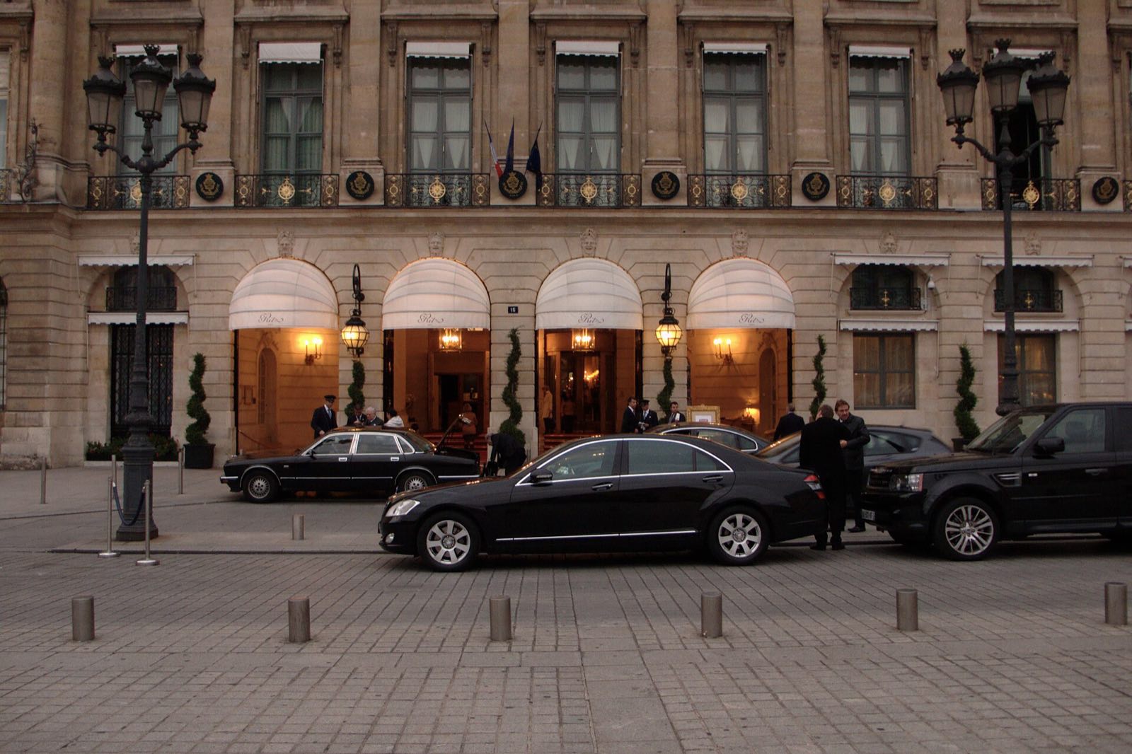 The front of the Ritz Paris on the Place Vendôme, its arched windows under white awnings.