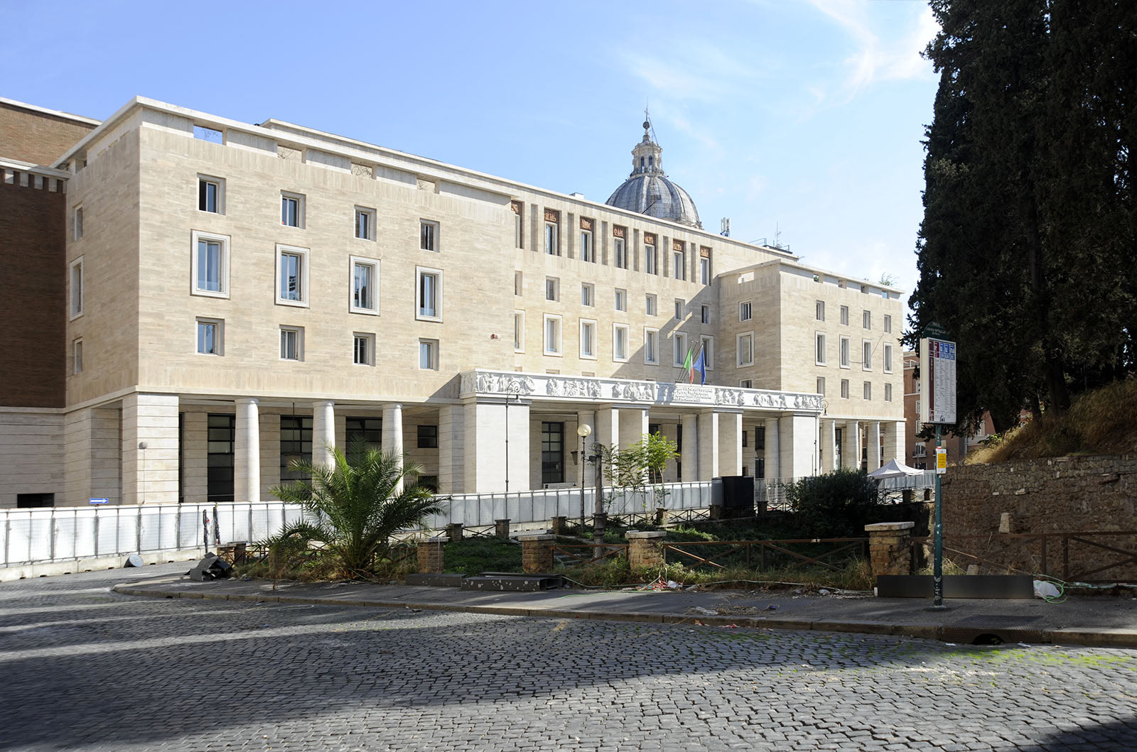 The travertine building of the 1930s on Piazza Augusto Imperatore that houses the Bulgari Hotel Roma, photographed in 2022 while it was being fitted out.