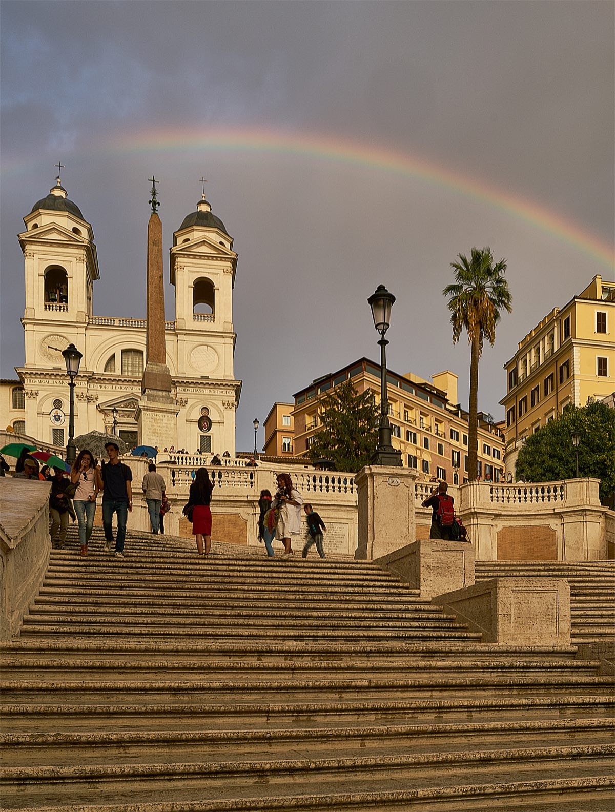 The Spanish Steps under a rainbow, with the church of Trinità dei Monti and the Hotel Hassler at the top.