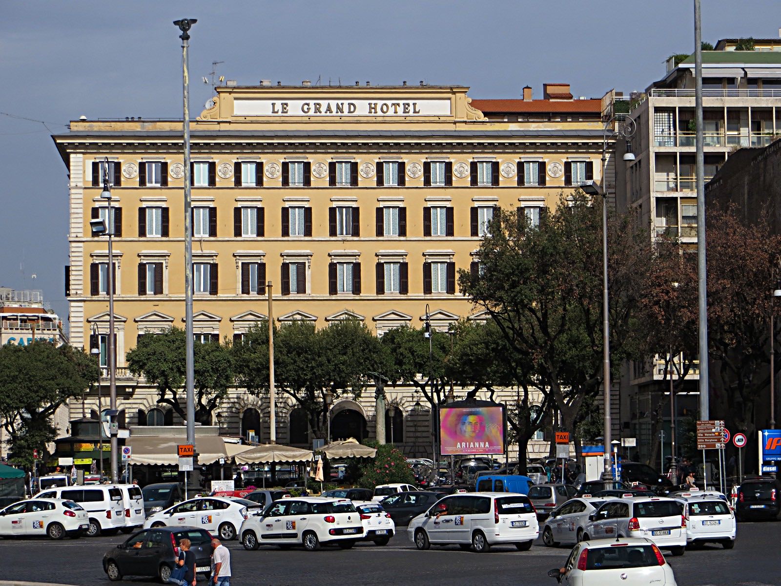 The long front of the Grand Hotel, now the St. Regis Rome, seen across the street.