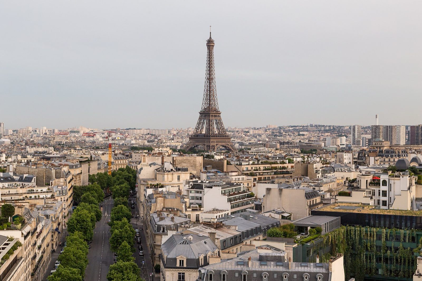 The Eiffel Tower rising over Paris, seen from above.