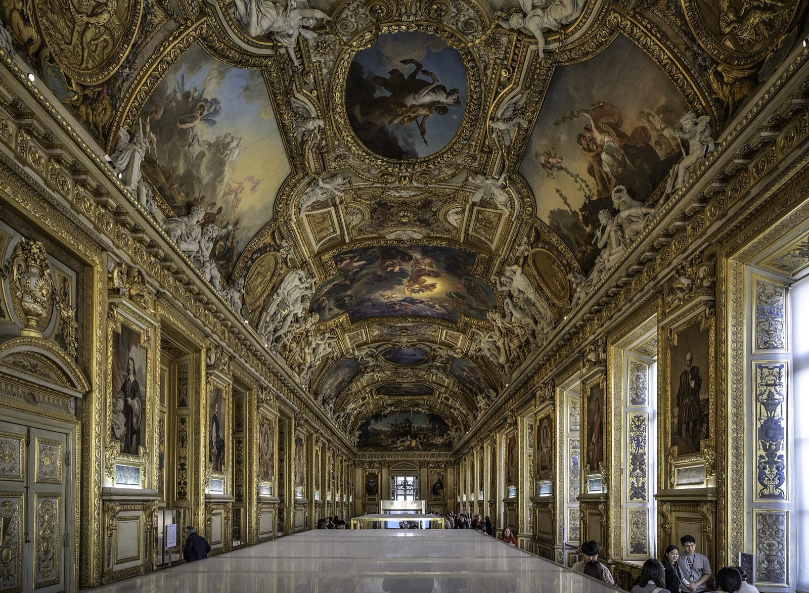 The Galerie d'Apollon in the Louvre, its vaulted ceiling covered in paintings and gilded stucco.