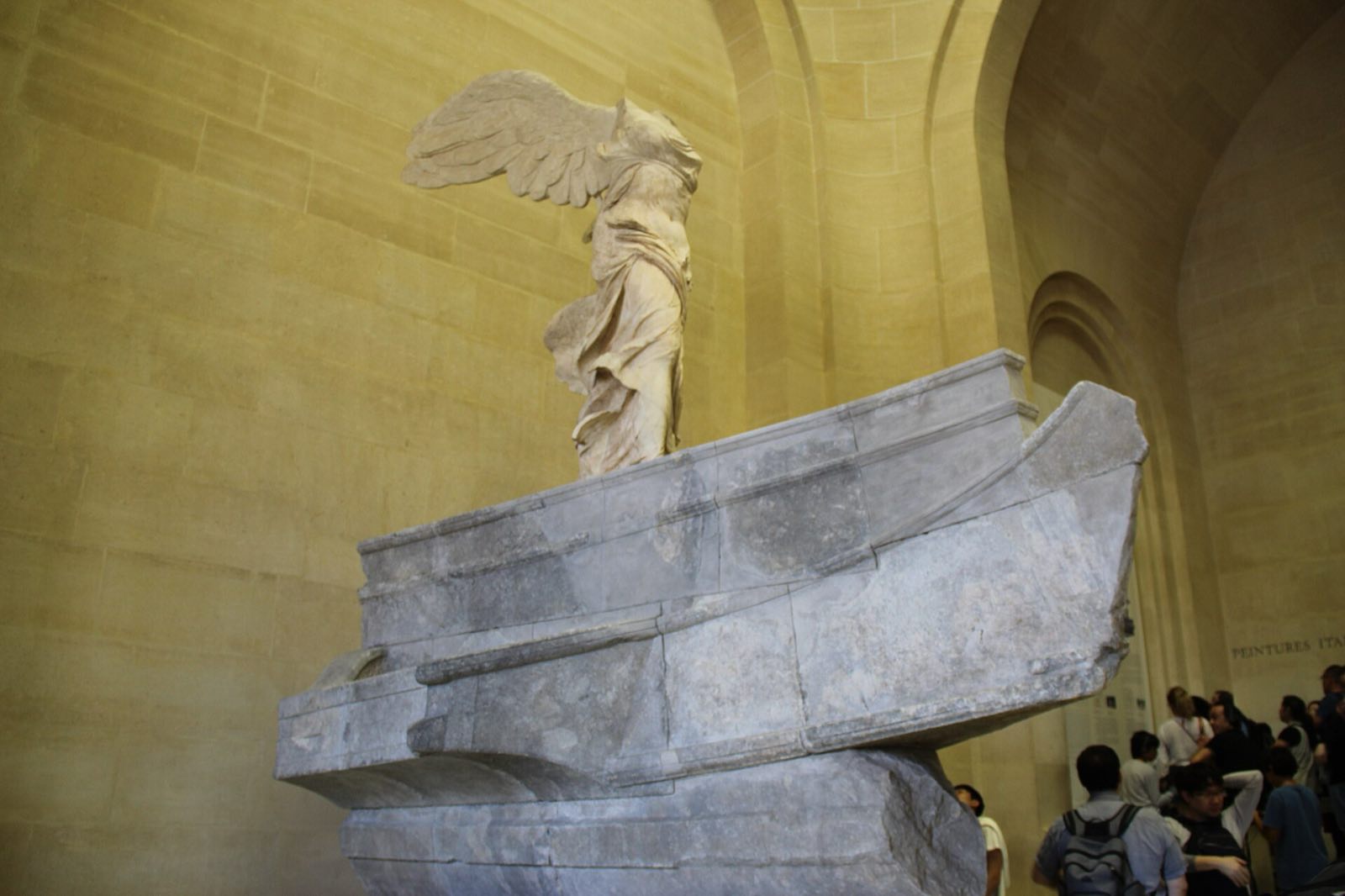 The Winged Victory of Samothrace on the prow of its stone ship in the Louvre.