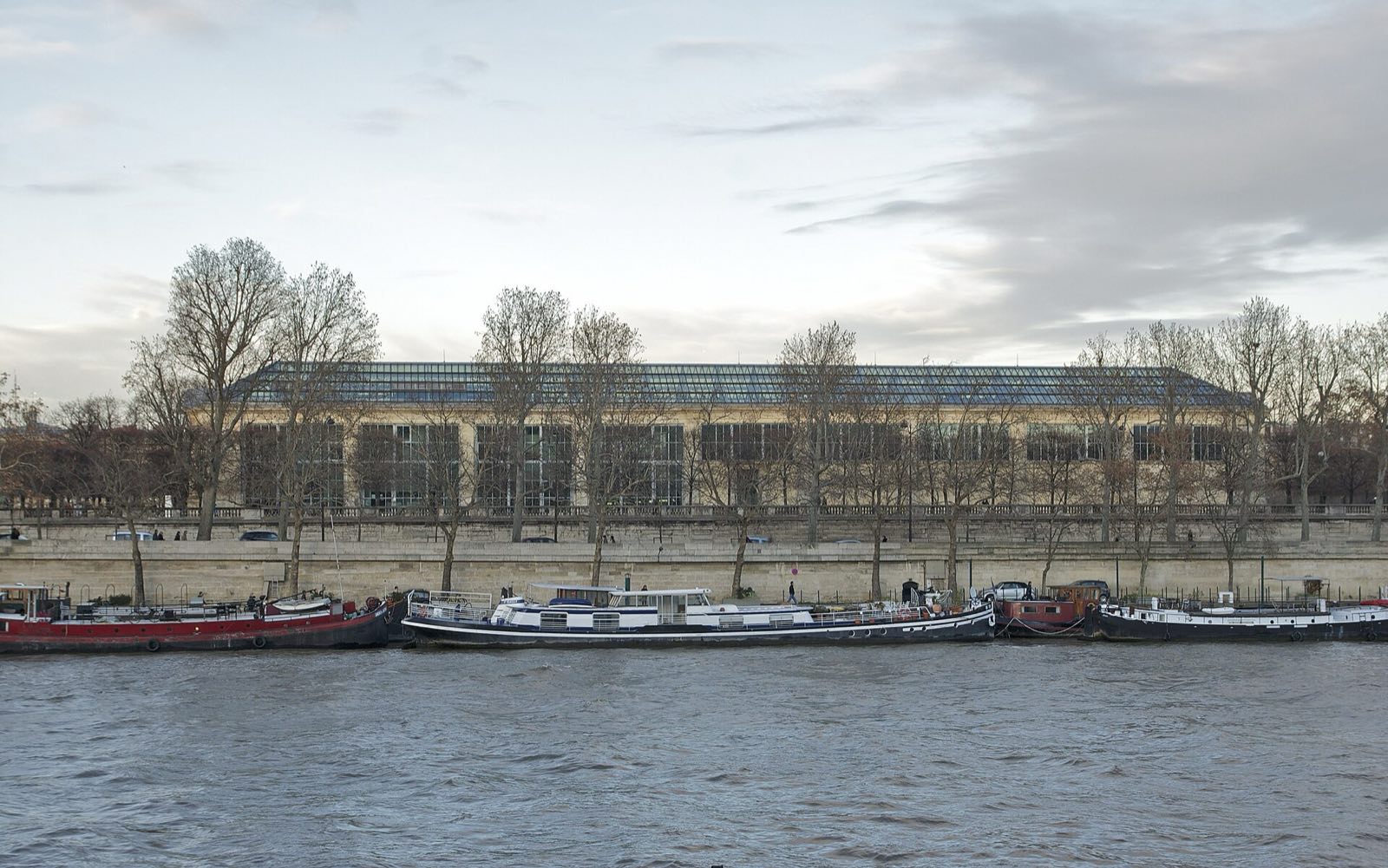 The long stone building of the Musée de l'Orangerie beside the Seine.
