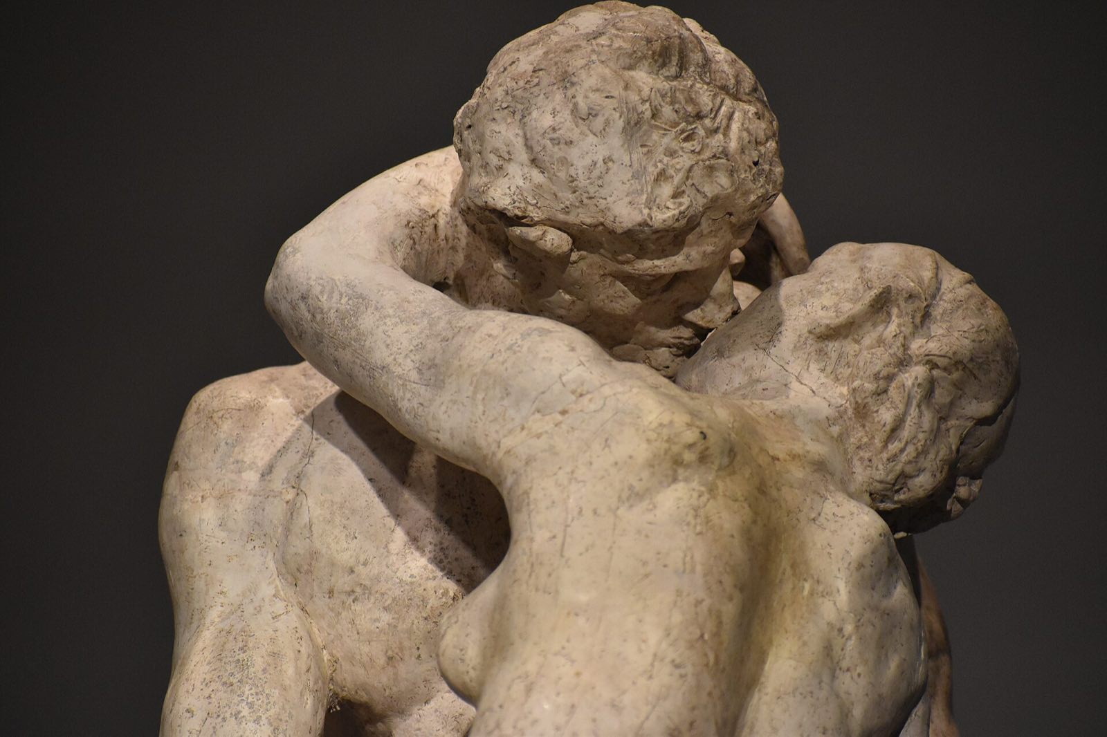 Rodin's The Kiss in marble, close up: two lovers in an embrace.