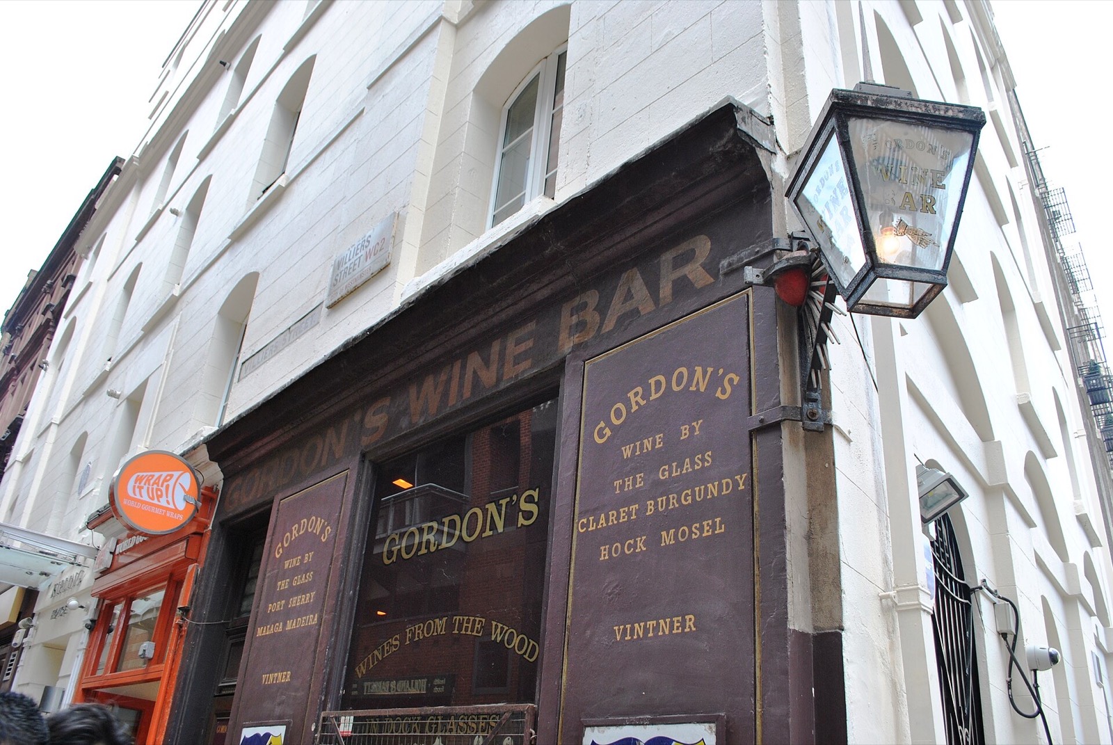 The doorway of Gordon's Wine Bar, under a lantern.