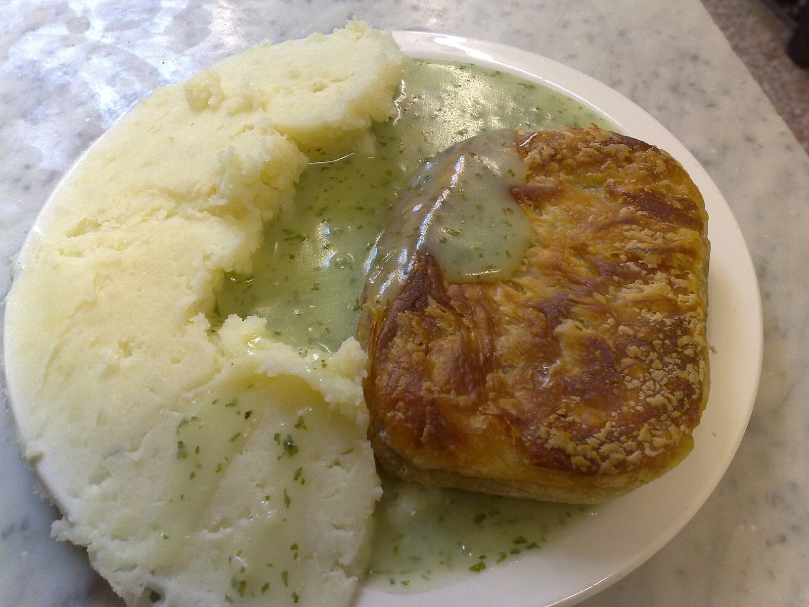 A plate of pie, mash and green parsley liquor at M.Manze.